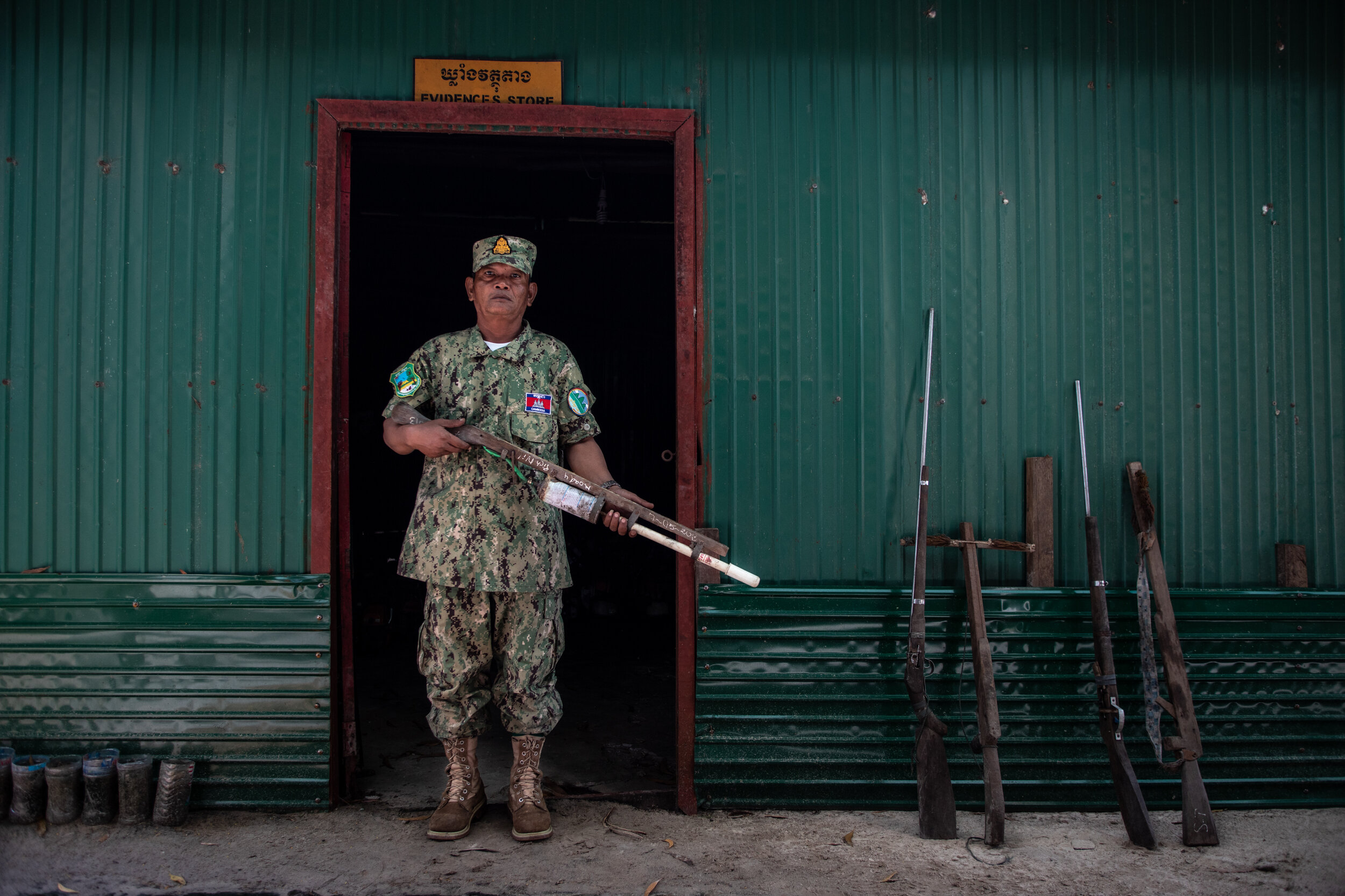  Ranger So Sokun, 57, shows some examples of the confiscated homemade hunting weapons used by poachers in the Cardamon Forrest. They range from old fashioned gun-powder muskets to hand-pumped air rifles and crossbow slingshots. The rangers confiscate