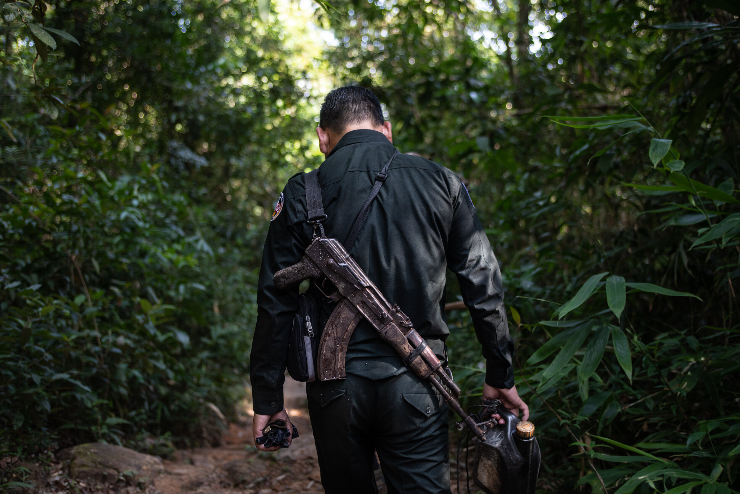  Pan Raksmey, 44, heads back to the station after a foot patrol in the Cardamom Forest.   Due to the vast amount of protected area to patrol and lack of resources, Wildlife Alliance rangers spend three weeks out of every month in the field, leaving o