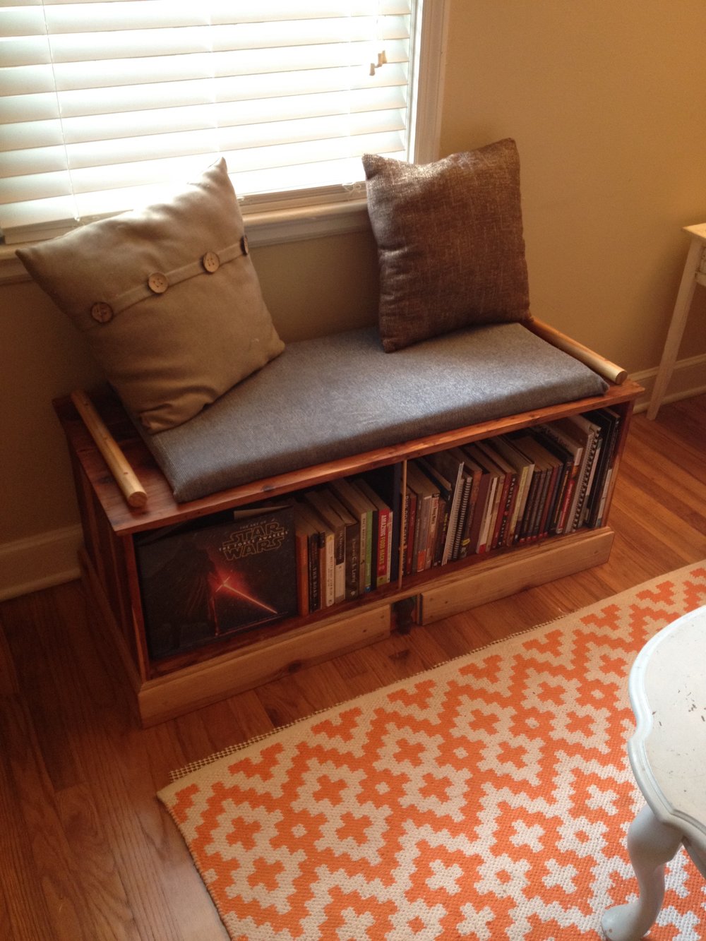  And the finished product! I added a little cushion too, for sittin', with plywood, $3 foam, and bought fabric. I also attached large dowel arm rails. I was going for fairly simple, classic but a hint of modern, but those rails made it middle-eastern