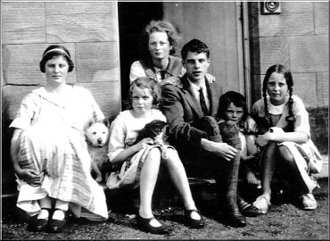 George as a young man with his siblings