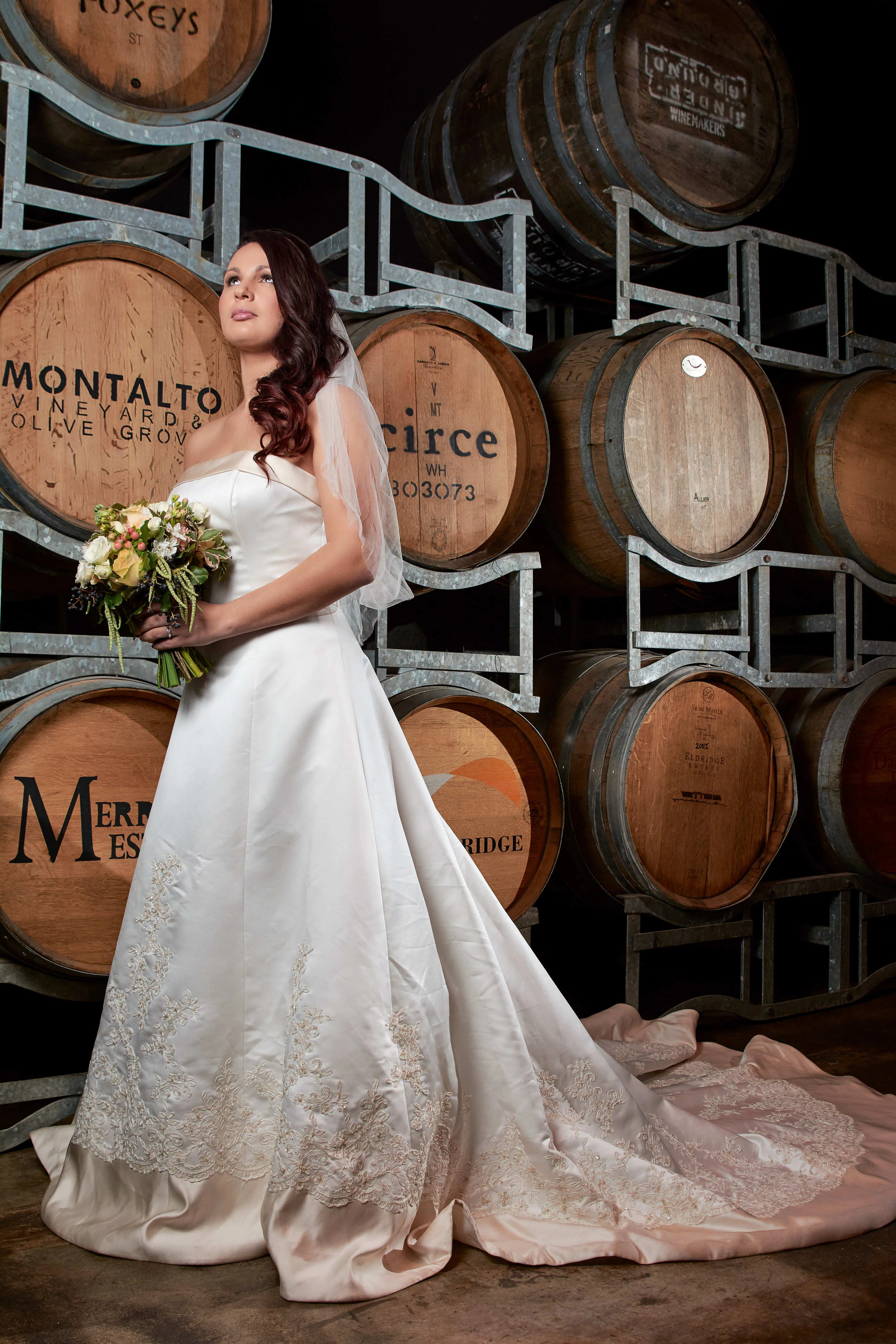 Bridal portrait in wine cellar at Red Hill Epicurean in Victoria, Australia