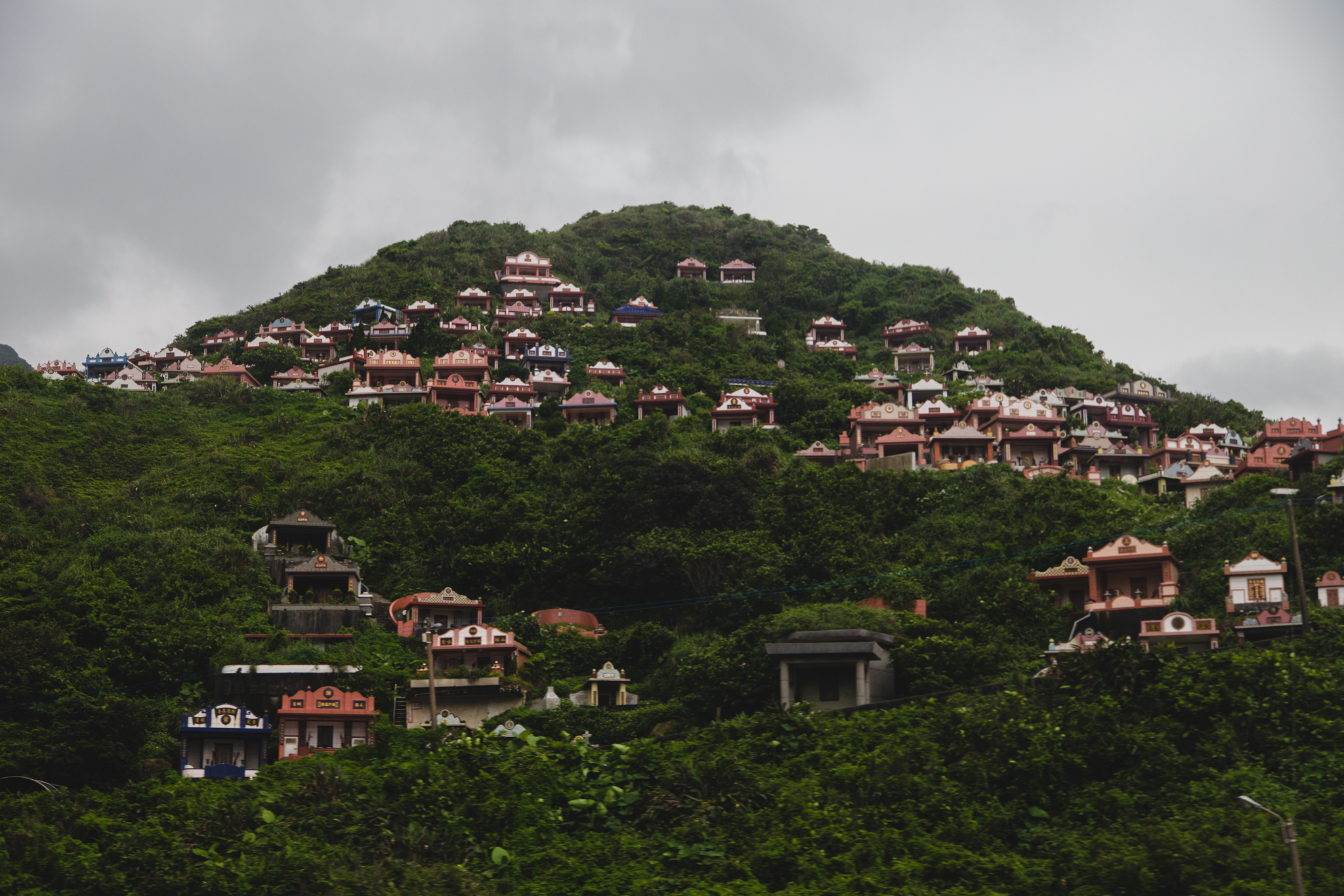 Supposedly if your tombstone back is to the mountains and you face the sea = good Feng shui