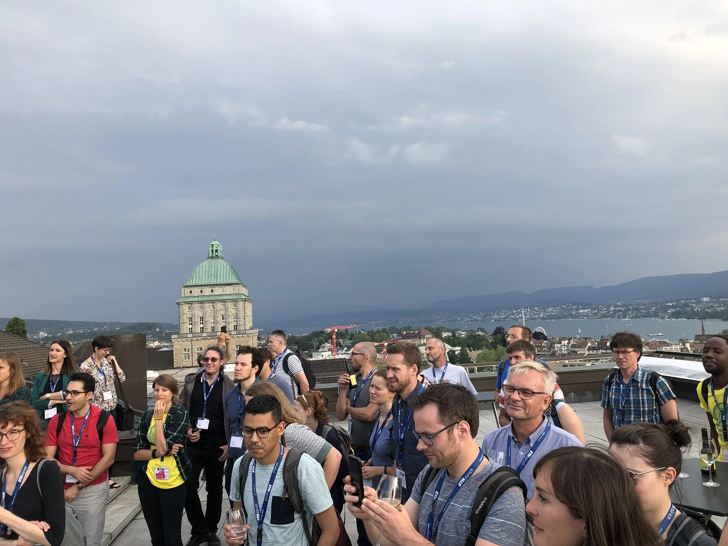Participants enjoying an apéro above the city at the Dozentenfoyer. Photo: G. Crain