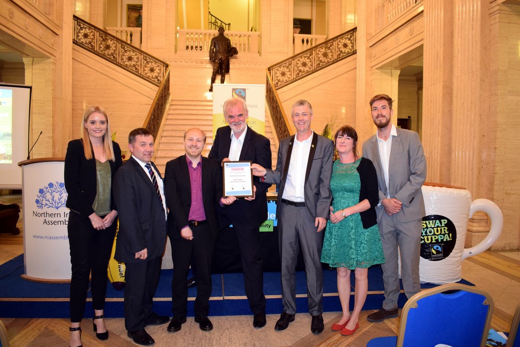 Certificate presentation from UK Fairtrade Foundation and Fairtrade Ireland declaring Northern Ireland as a Fairtrade Devolved Region (19 June 2017) in the Great Hall, Stormont Parliament Buildings, Belfast (R-L): Adam Gardner, Communities Campaign Manager - UK Fairtrade Foundation; Anne Irwin, Director and Co-founder - Suki Tea; Dr Christopher Stange, Secretariat - All Party Group (APG) on Fairtrade & Consul for St. Vincent and the Grenadines to Northern Ireland; Tim McGarry; Steven Agnew MLA, Chairperson - APG on Fairtrade; Robin Swann MLA, Member - APG on Fairtrade; Emma Daly, Business Development Manager - Fairtrade Ireland