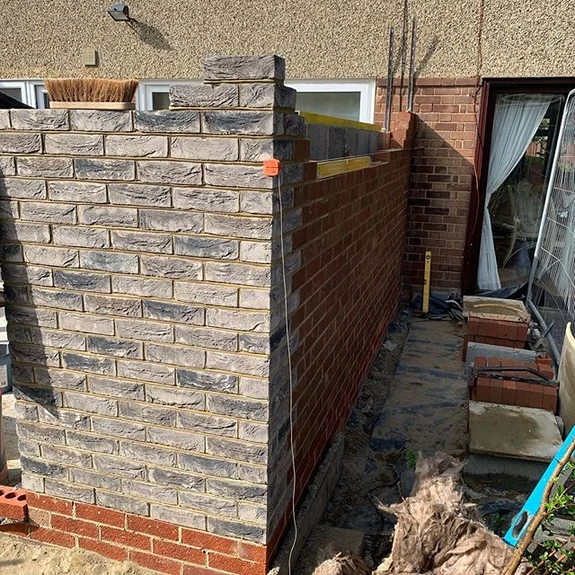 Brickwork up a lift and waiting on scaffold, plus we managed to dig out and concrete the neighbours patio ready to receive sandstone. #greybricks #greyistheway #modern #contemporaryarchitecture #specialists