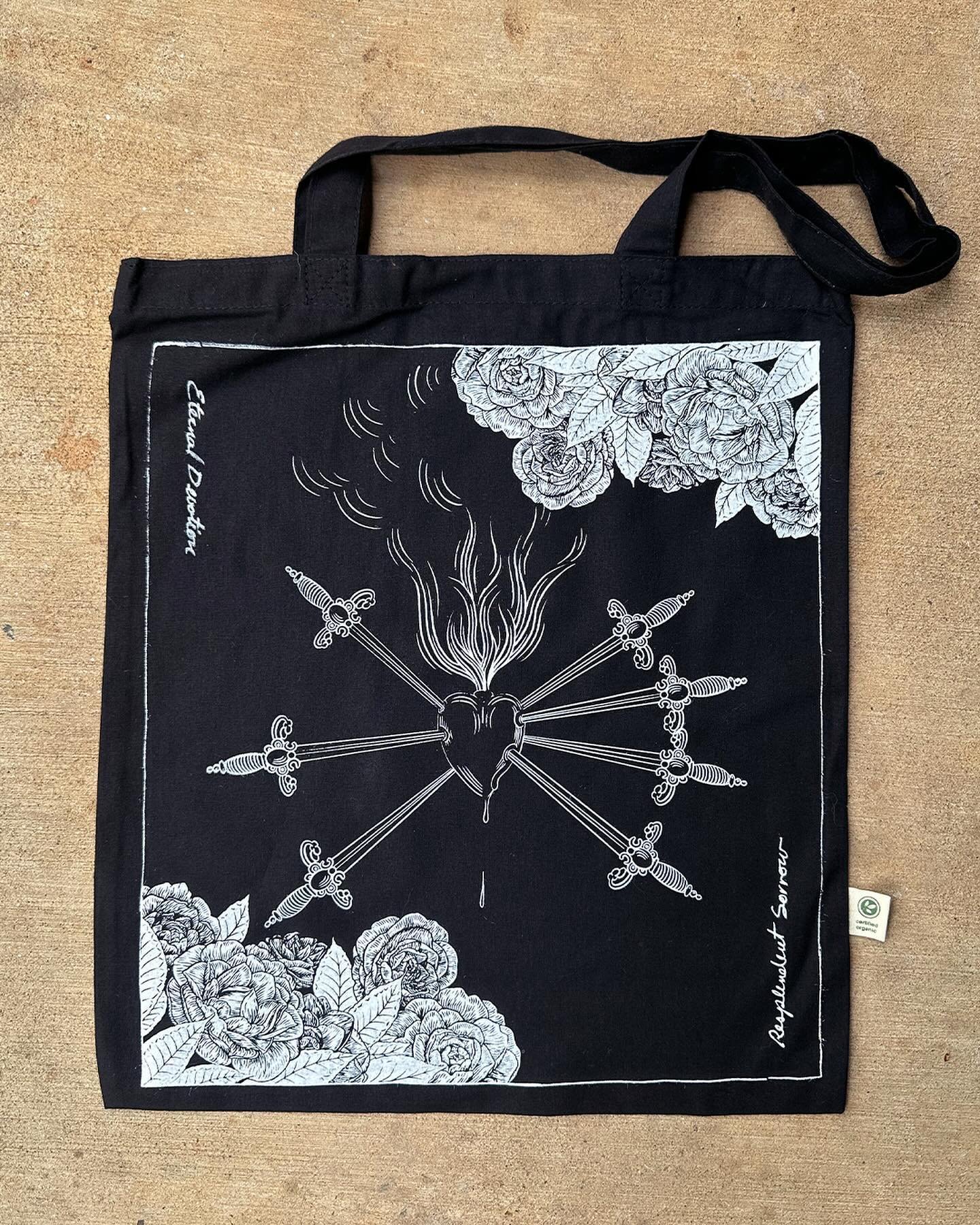 Catholicore? I&rsquo;ve got a bag you might like. The Eternal Devotion tote features the heart of Mater Dolorosa (Our Lady of Sorrows) with hand scrawled phrases &ldquo;Eternal Devotion&rdquo; and &ldquo;Resplendent Sorrow.&rdquo; These totes are in 