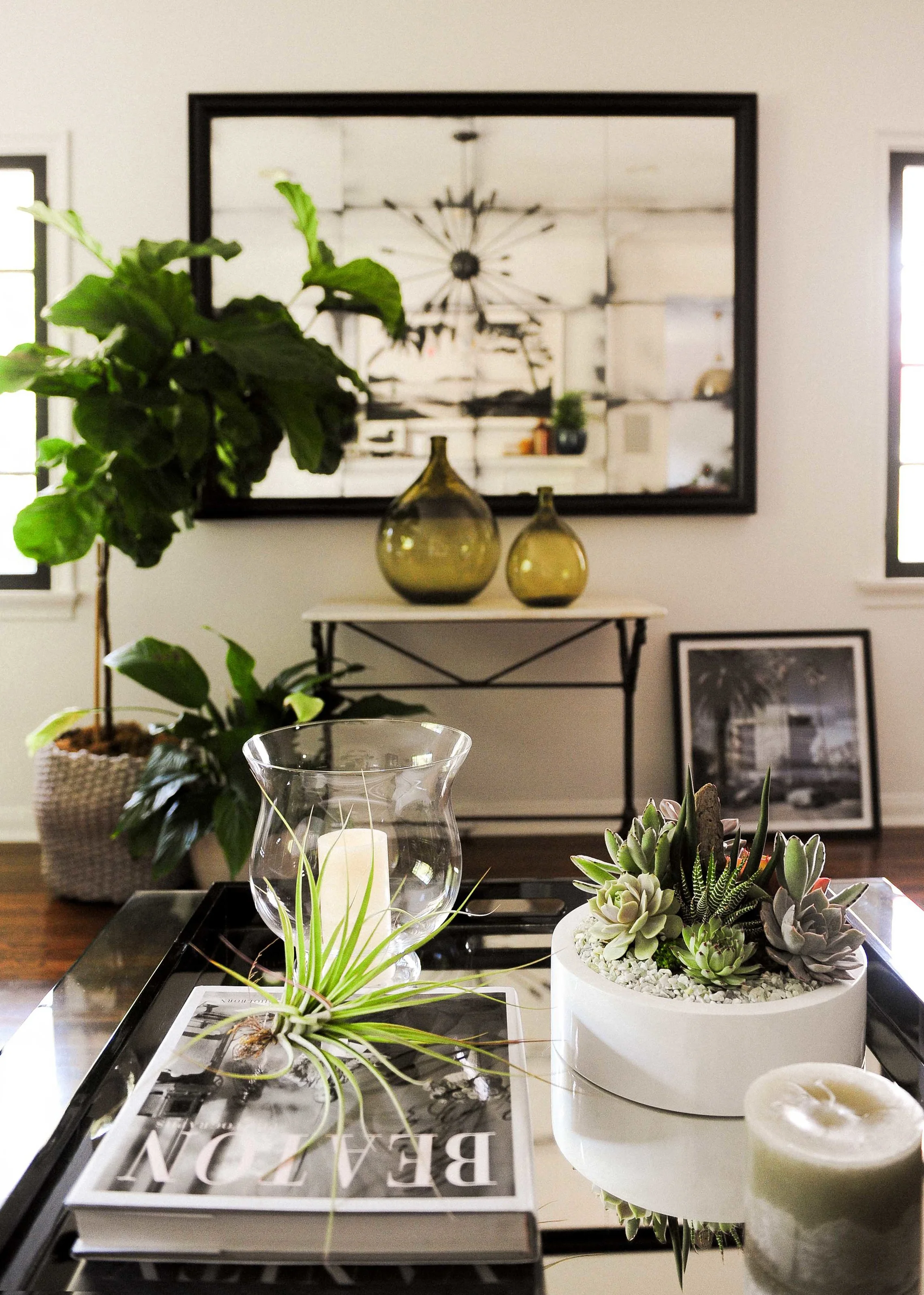 Items from Rolling Greens: antique marble console table with iron base, vintage green glass bottles, succulent arrangement and all greenery and vessels.