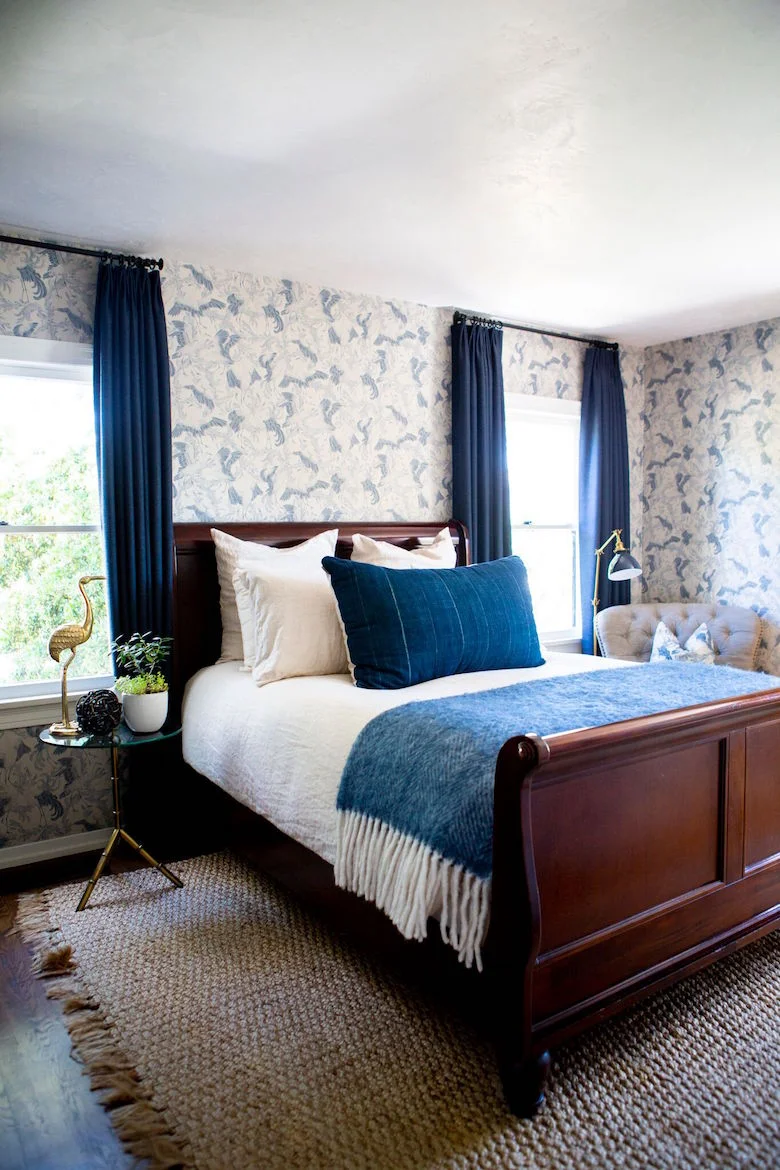 Sara’s guest room featuring our indigo lumbar pillow and side table arrangement.
