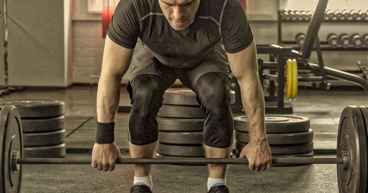 man getting ready to clean deadlift