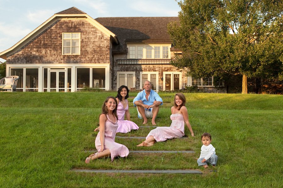 Family in front of house