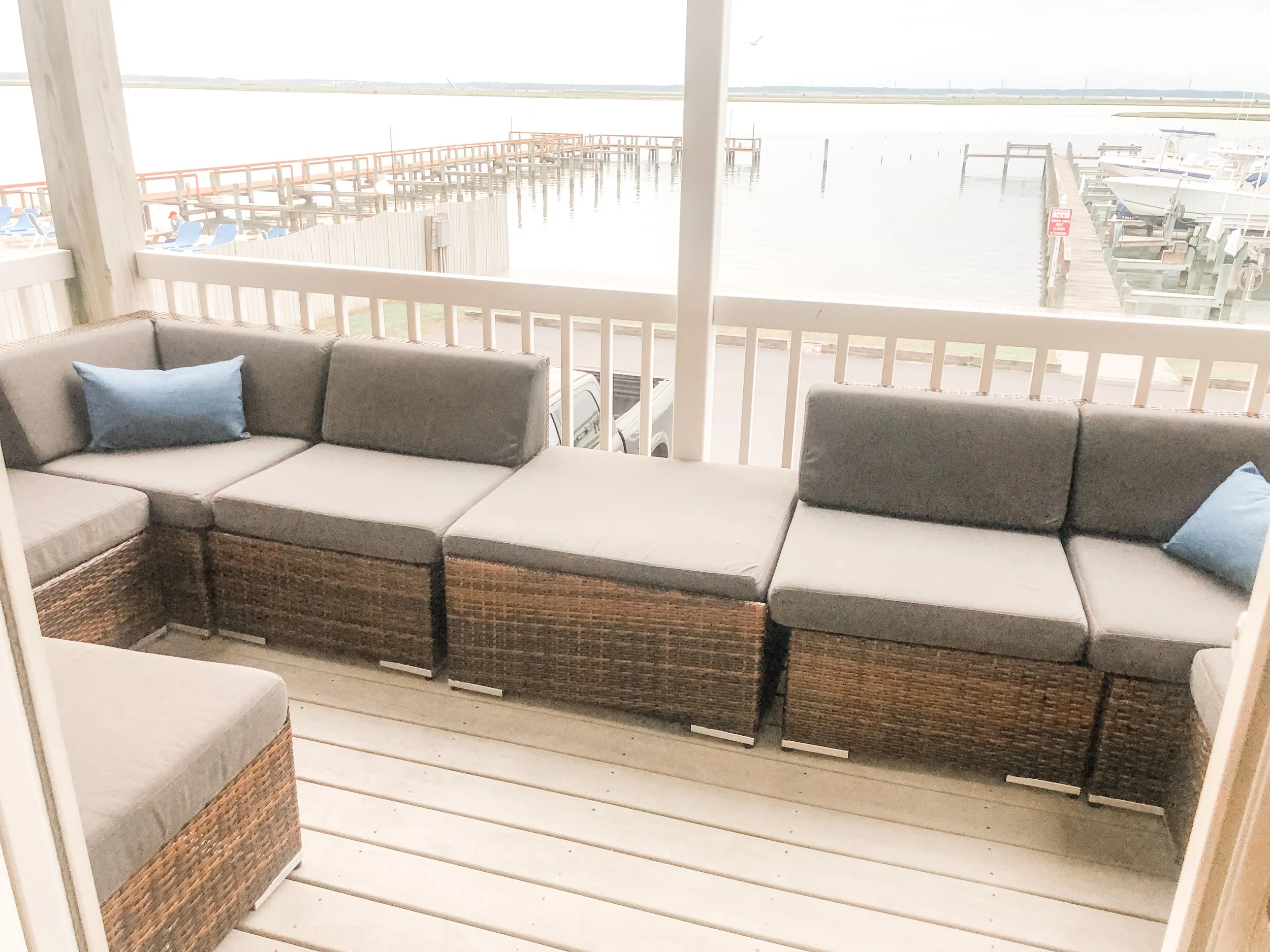 Deck off main living level with expansive seating overlooking the bay