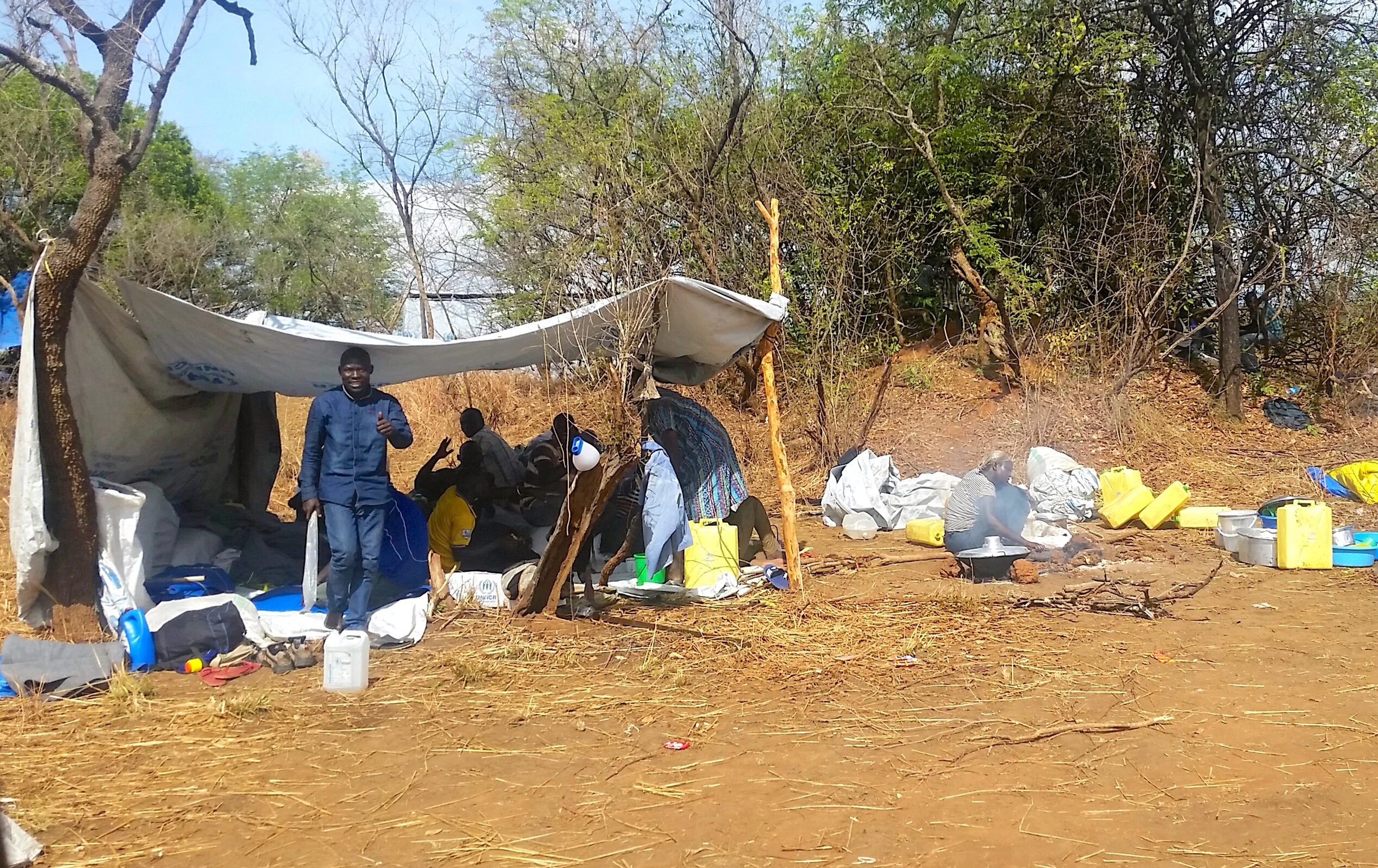 New "permanent homes" are erected for the South Sudanese refugees. Most are coming across the border with nothing but the clothes on their backs. These tarp tents are meant to protect them from all the elements: rain, wind, and soaring African heat.