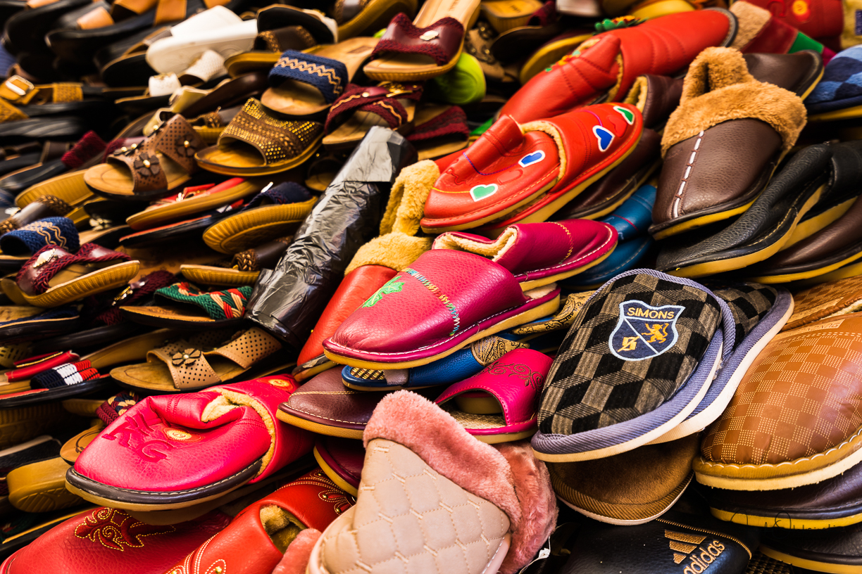 A lot of shoes on display throughout the market