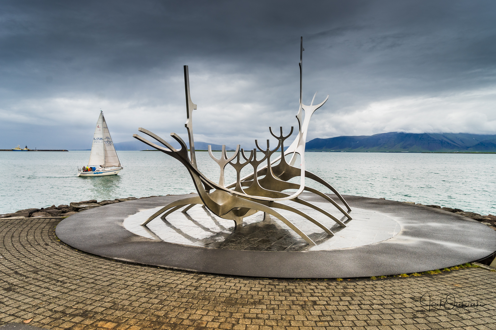 Sun Voyager (Icelandic: Sólfar) by Jón Gunnar Árnason located in the harbour