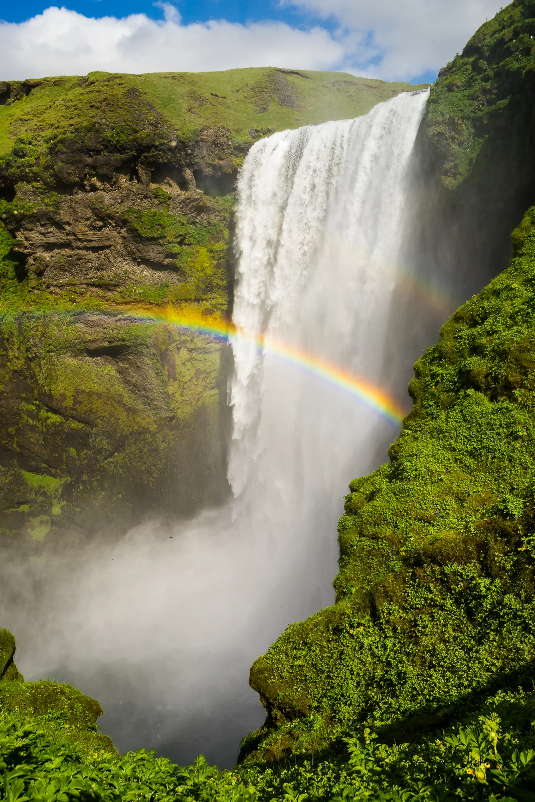 Walking up close up to the Skogafoss waterfall.