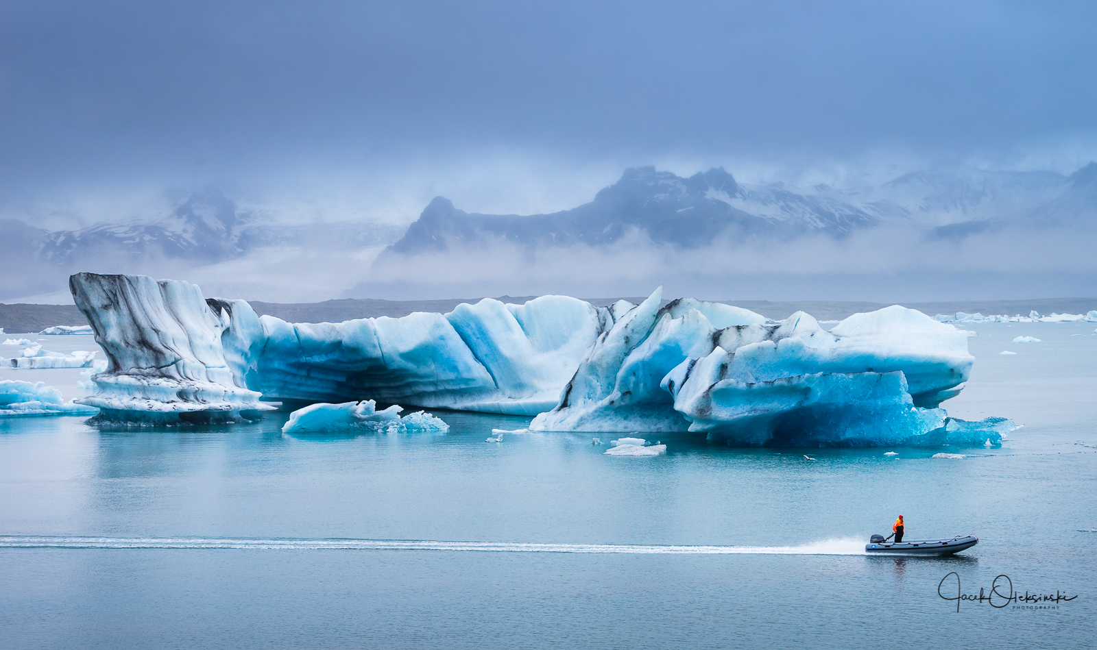 The smaller boats can get closer to the icebergs