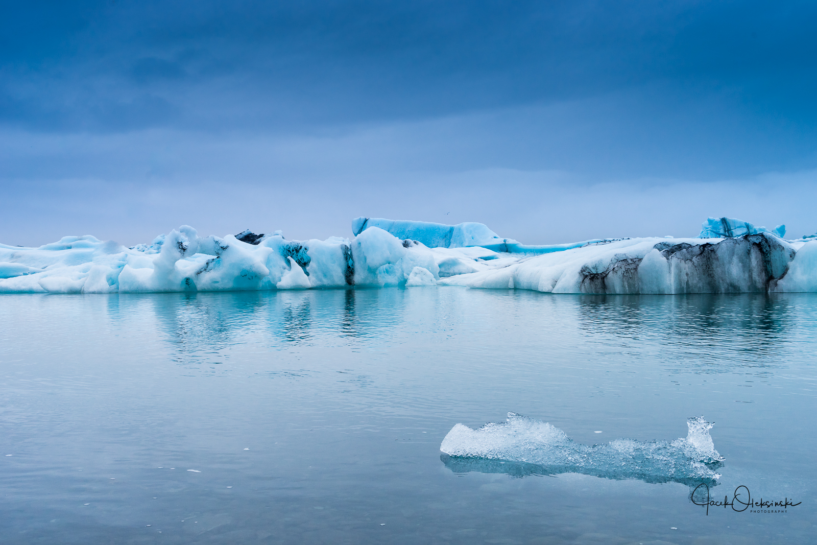 Floating icebergs, some larger some smaller