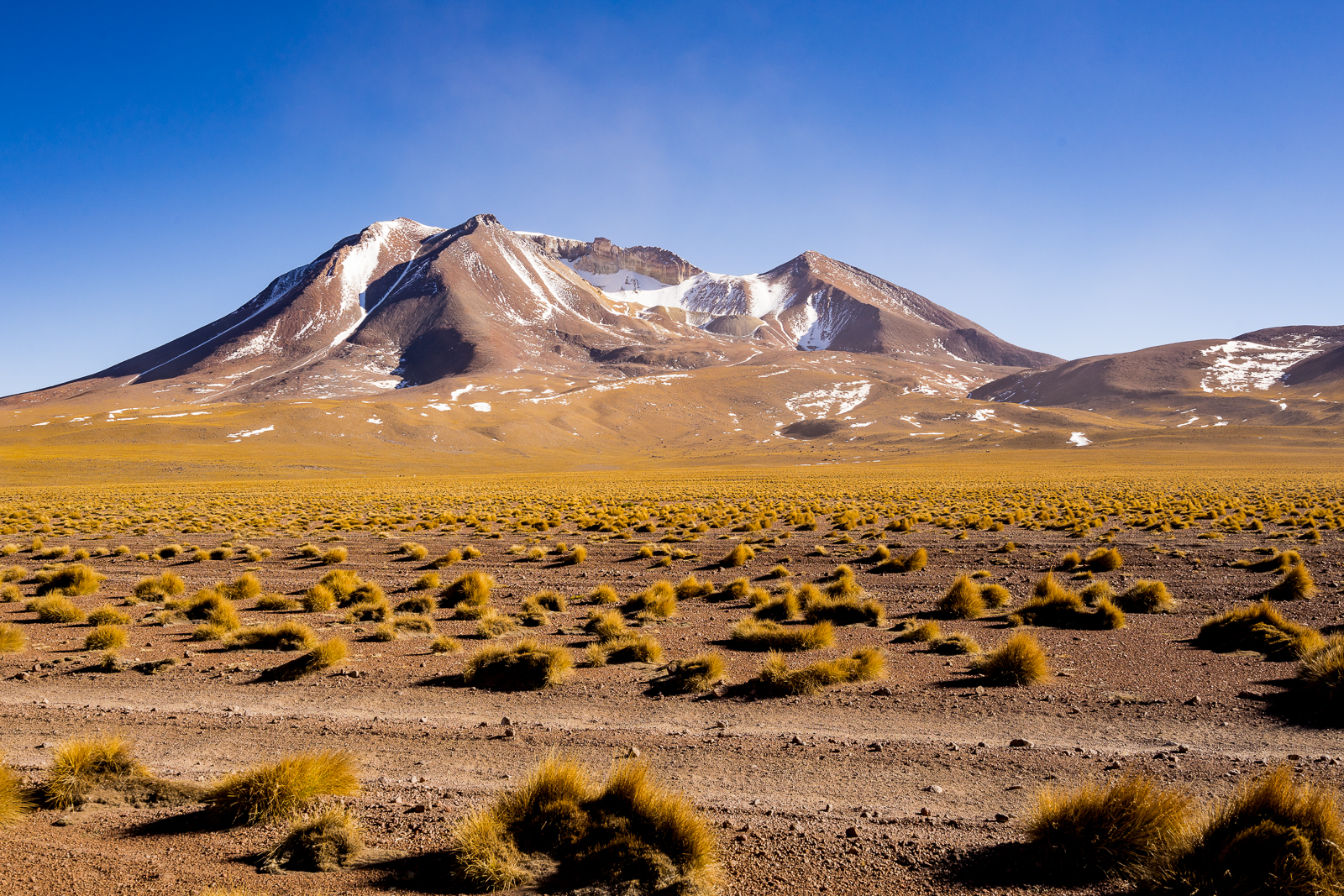 Sand, grass and mountains. Completetly deserted apart from the sporadic basic hostel.