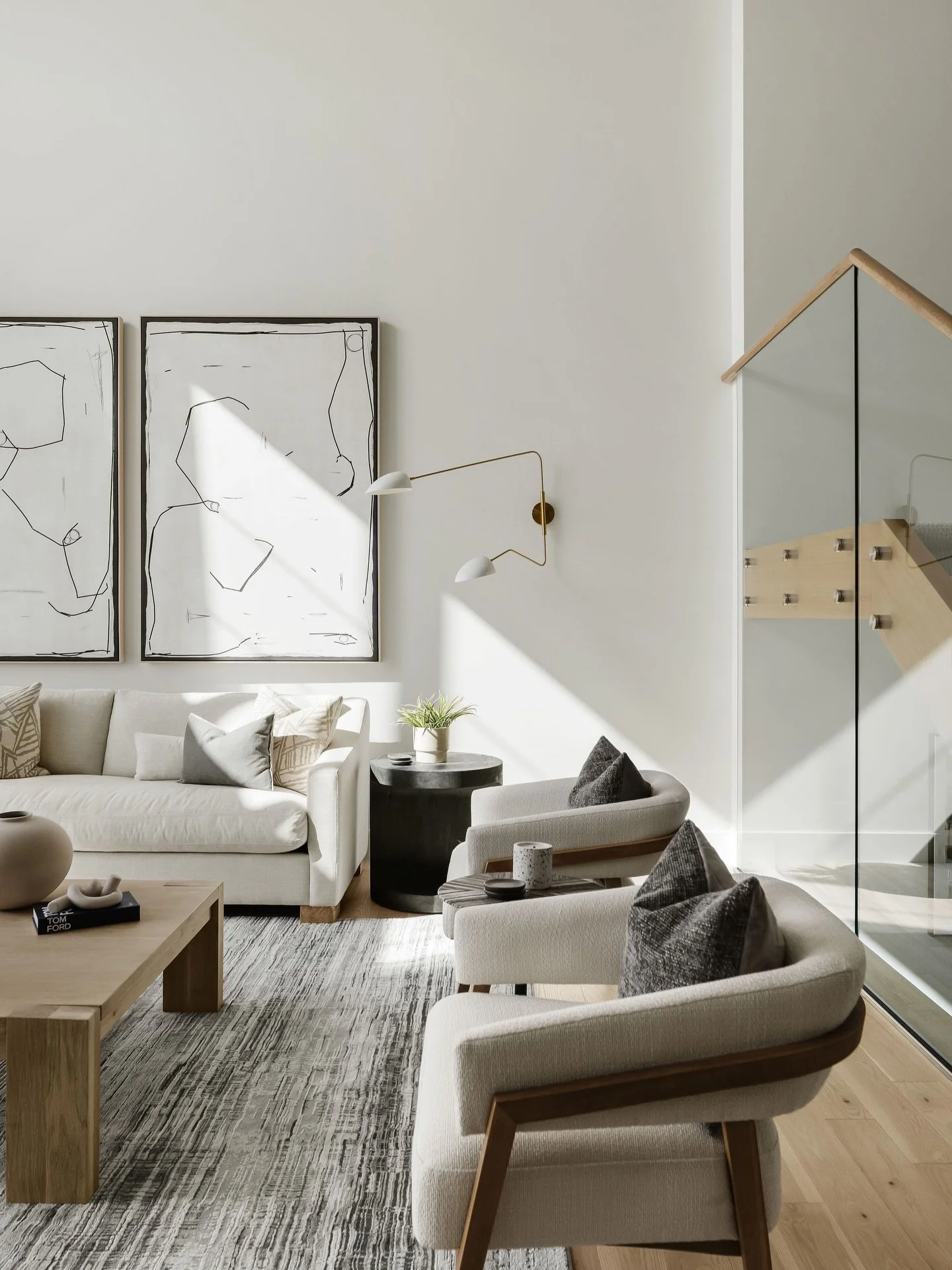 Designing a space is more than just filling it, it's about crafting the atmosphere. 

In this project, the architecture provided an abundance of height and natural light. Our task was to add warmth, scale, and texture through thoughtful furniture cho