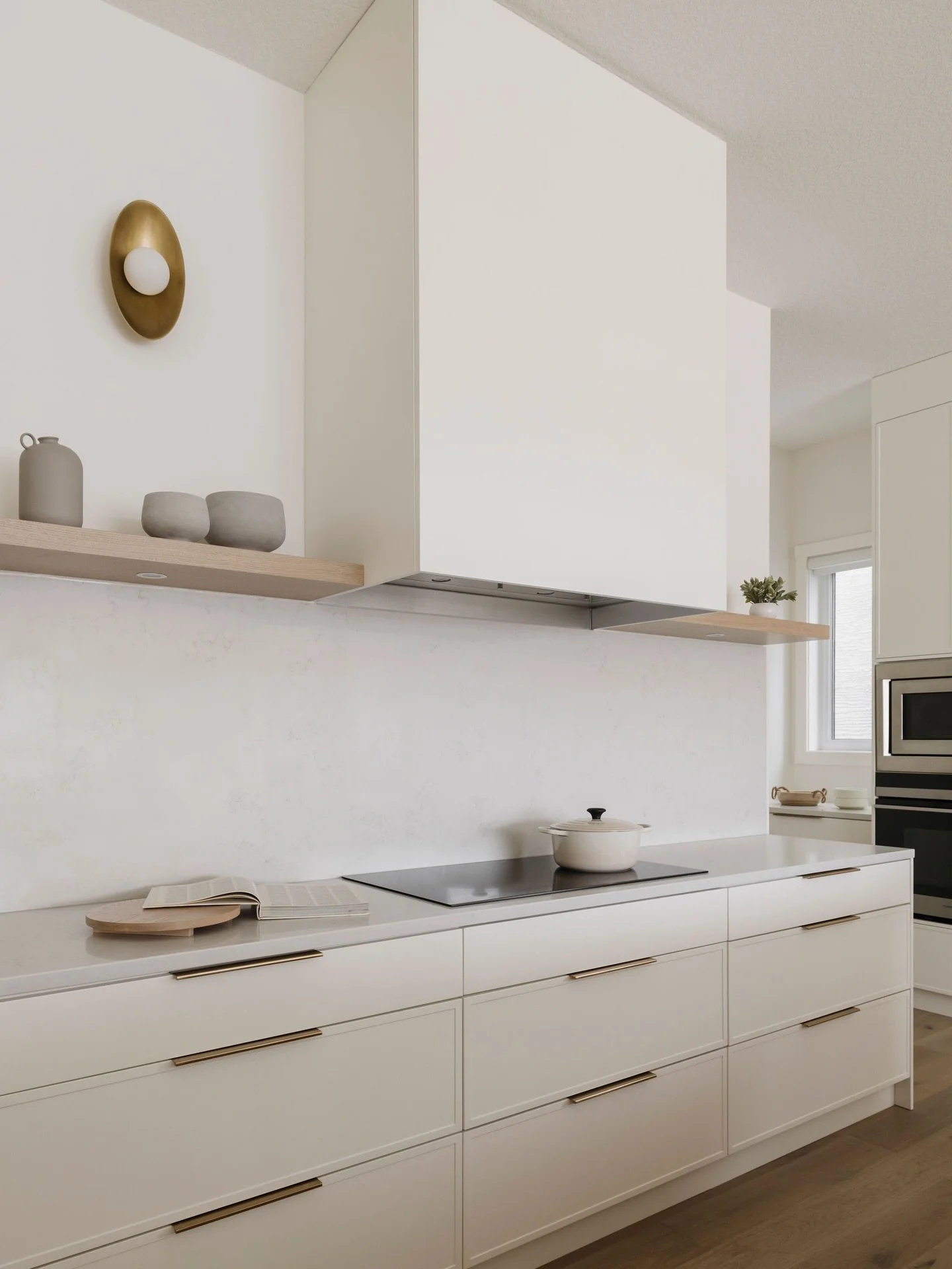 A kitchen that leans into simplicity. A soft color palette with warm wood, off white cabinetry, and just enough contrast to keep it interesting with brass hardware. 

Nothing feels overworked. Clean lines and thoughtful details. Easy, functional, and