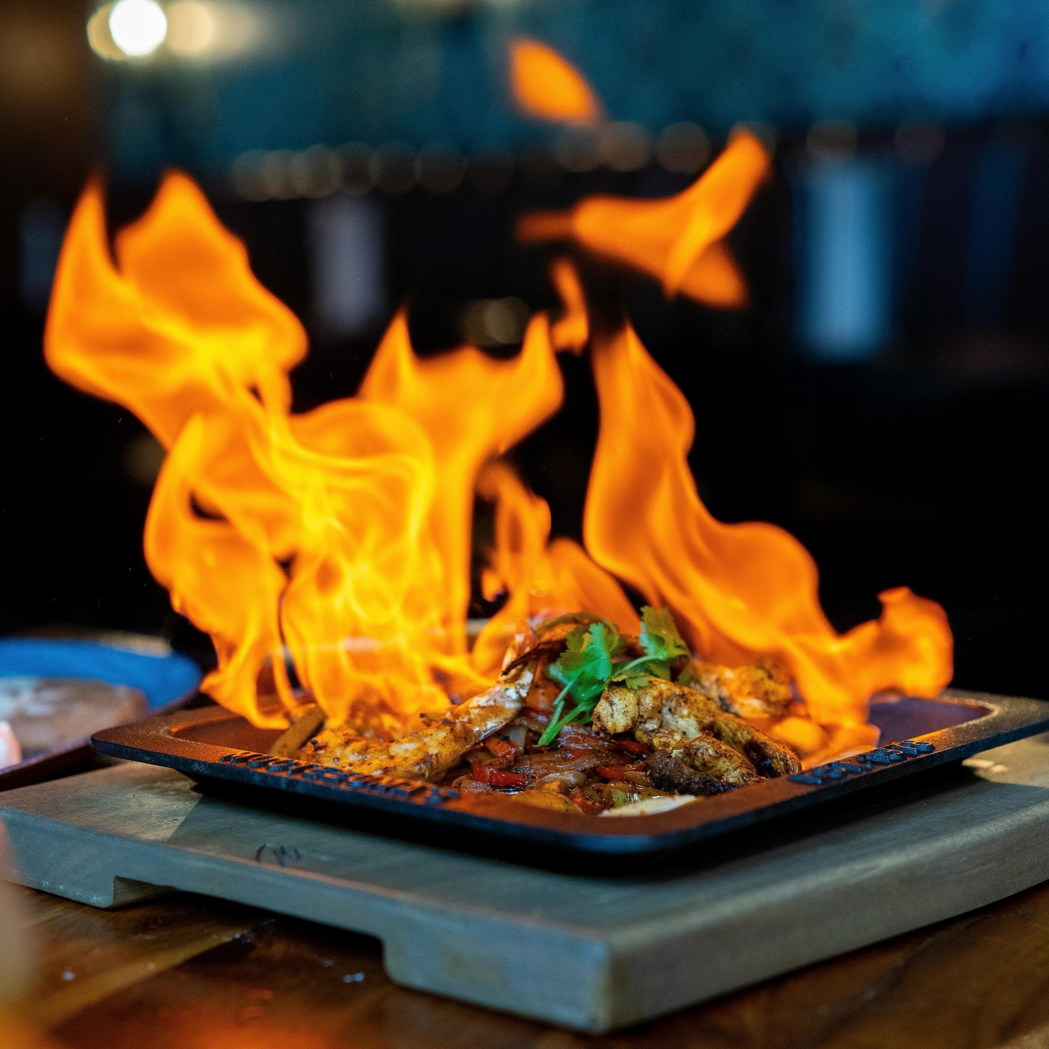 Ignite your taste buds with the fiery spectacle of Tequila Flaming Fajitas. This sizzling blend of flavors is where succulent grilled goodness meets the exhilarating touch of tequila flames. To find your nearest location, visit us online at https://w