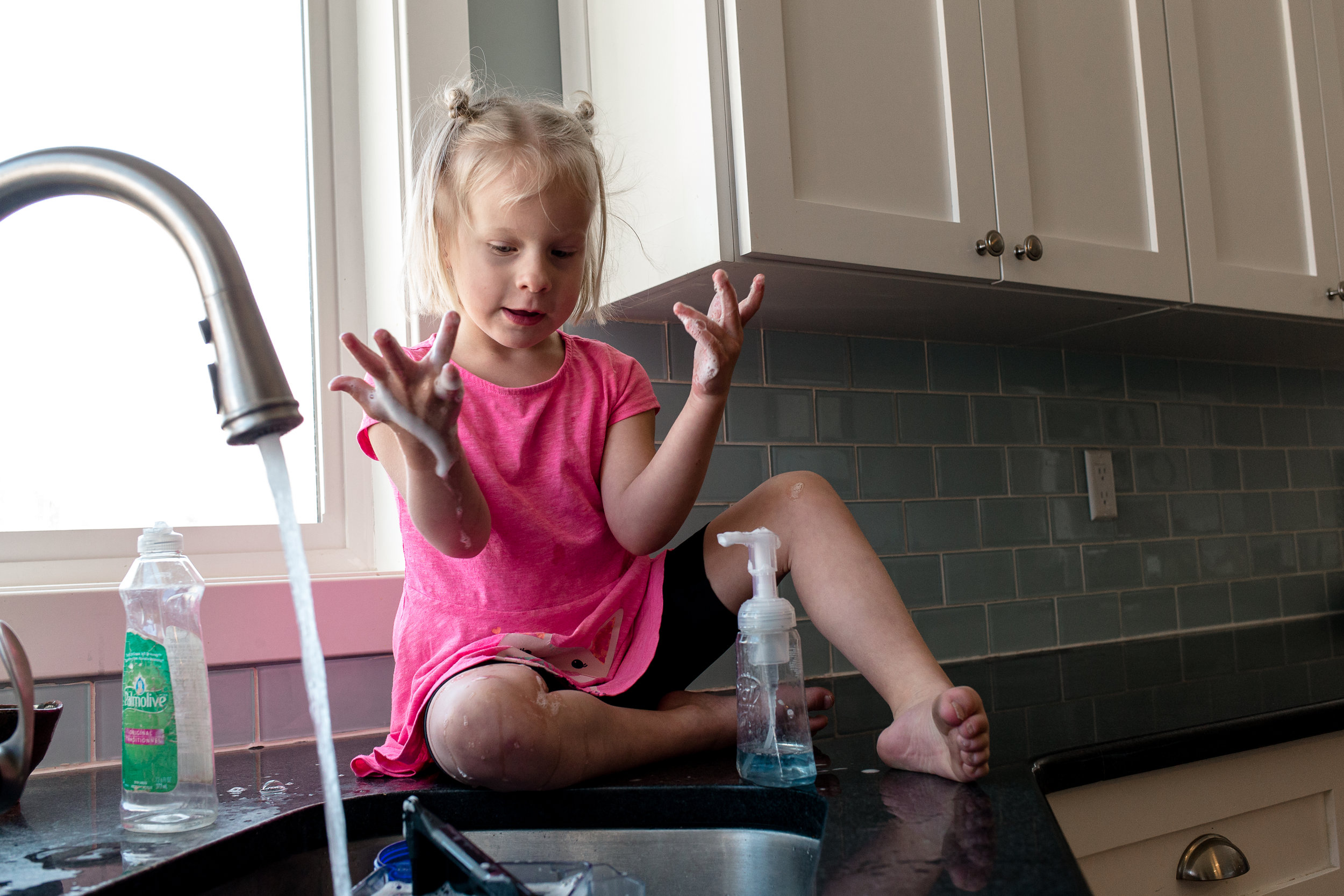  For some reason, Nora decided to climb onto the counter and "wash her hands" for a good 20 minutes and made a huge mess.&nbsp; 