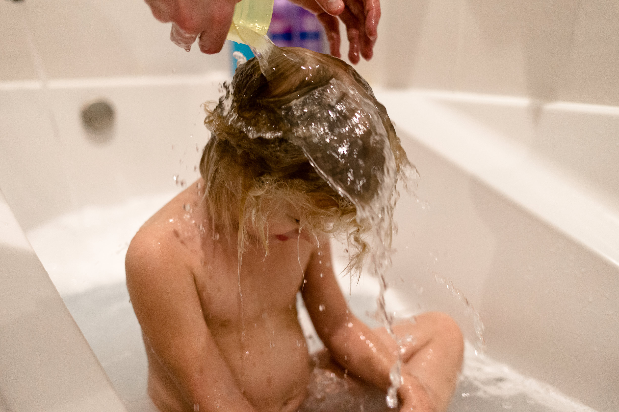  Daddy washing her hair. 