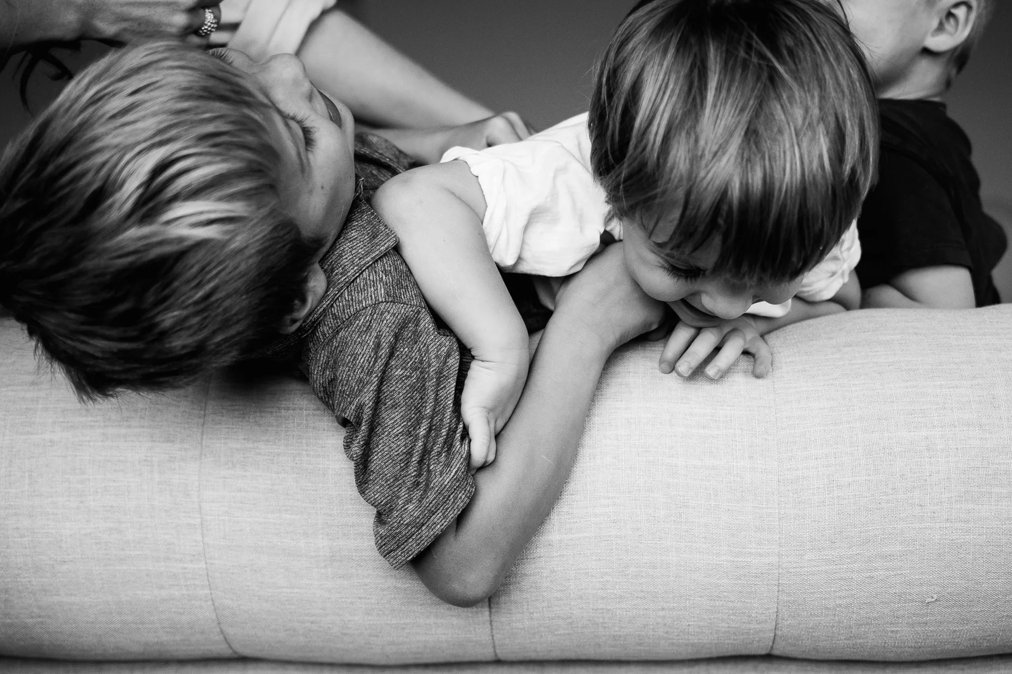 Boys rough housing on bed - Utah family lifestyle photographer