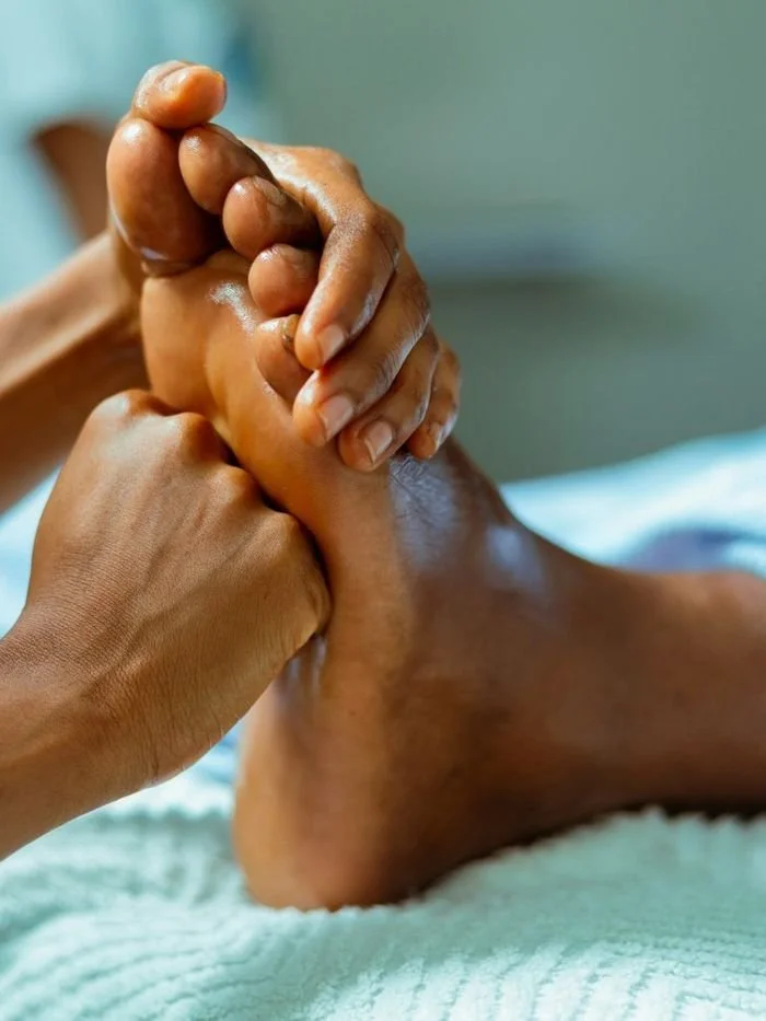 Massage therapist working on a client’s foot