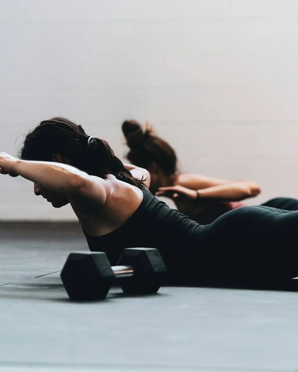 Woman doing a back-extension exercise on the floor