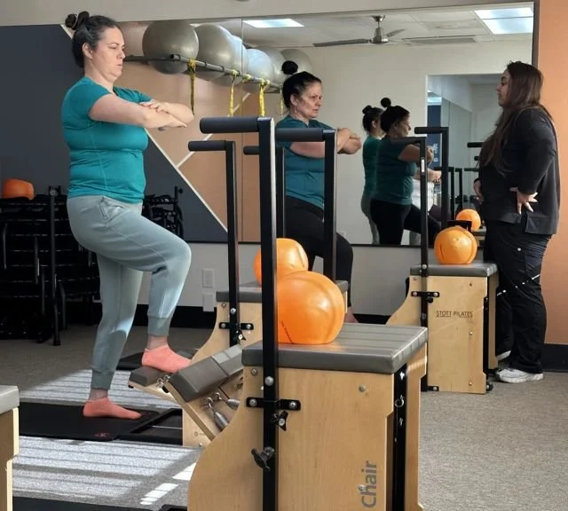 Client working out on the Pilates stability chair