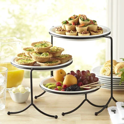 Display that Meal. Give your table layers and height when you display those appetizers that you slaved over. My go-to is always a tiered plating tower, like this one. It's inexpensive, and you can find it at Pier 1 Imports.