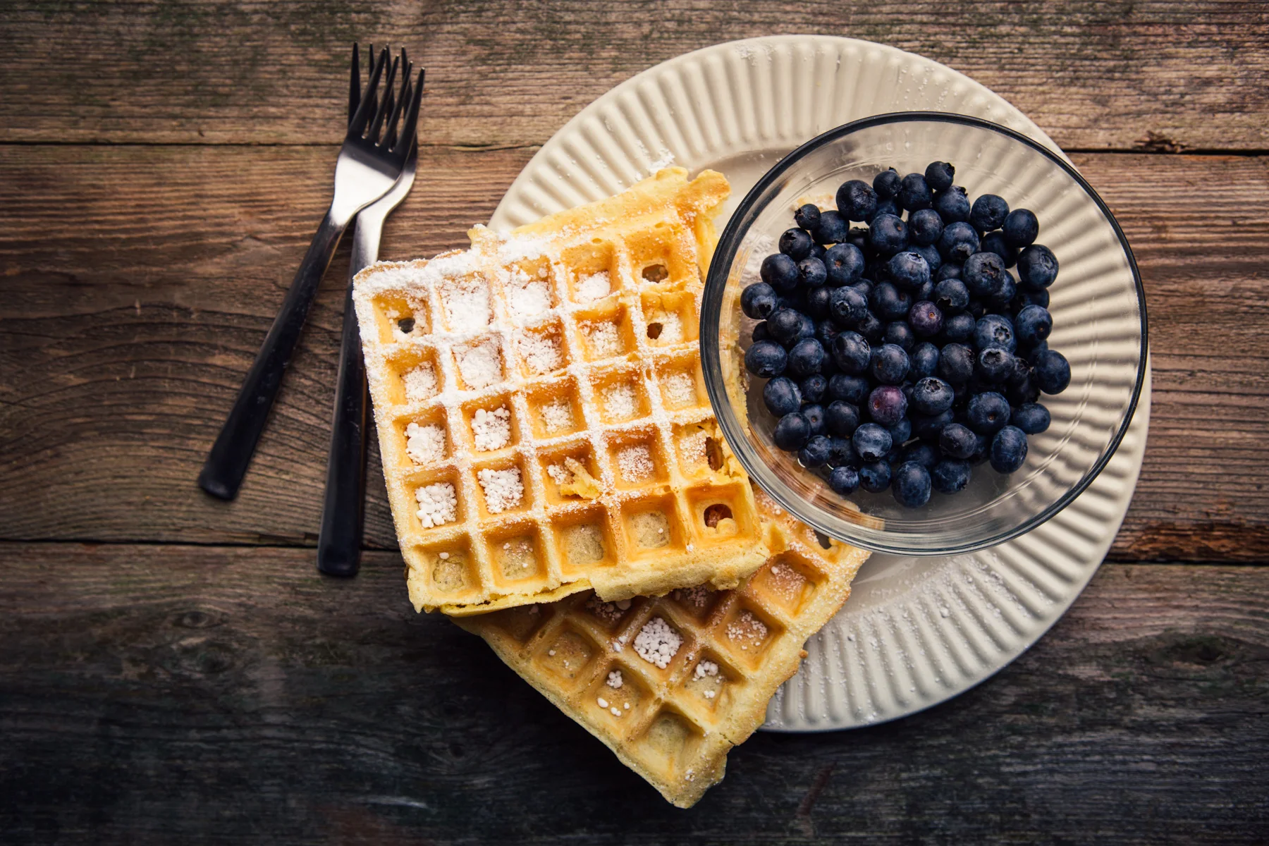 Belgian waffles and blueberries. Studio lighting.