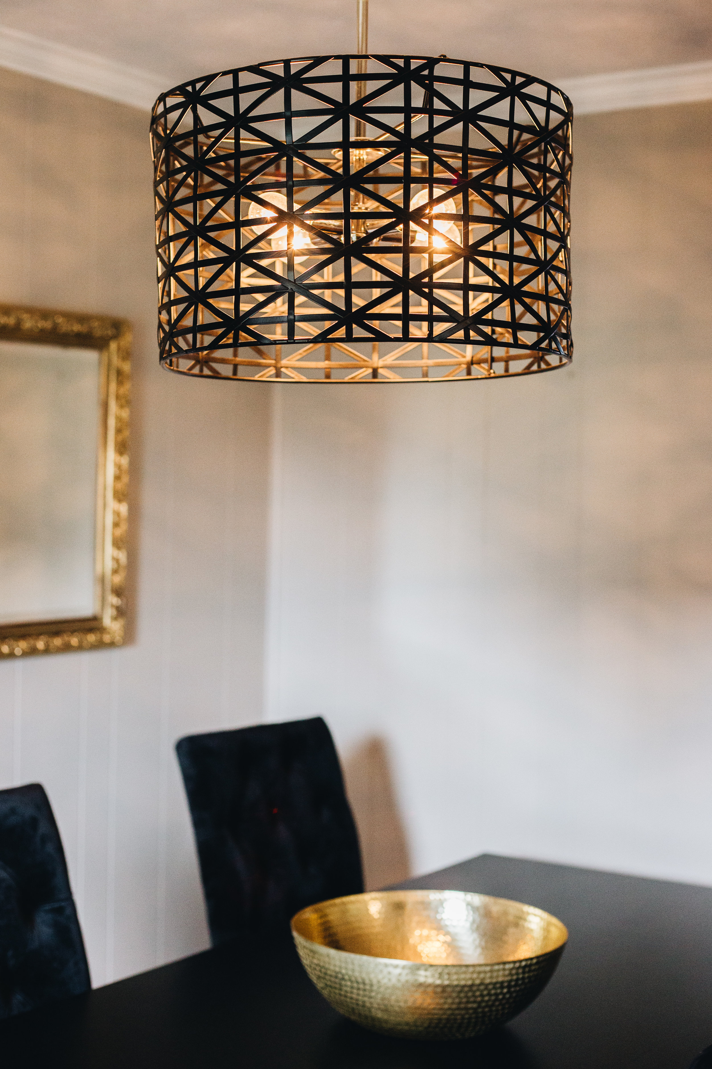 beautiful details with this metal drum light. we turned an old mirror into a beautiful accent by painting the frame gold.