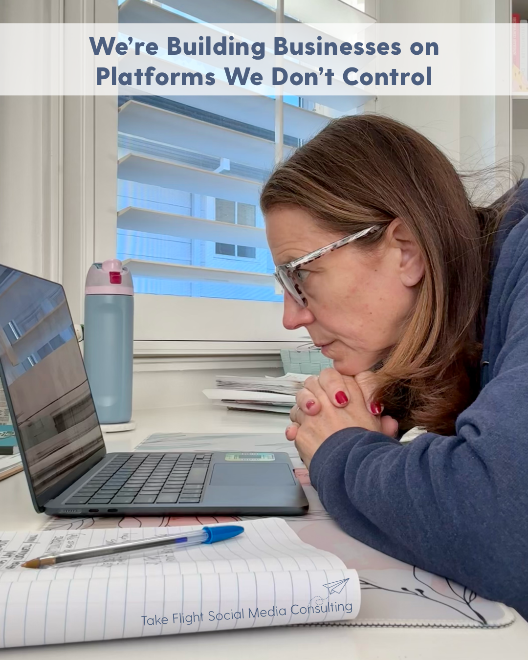 Social media consultant working at laptop after Meta account suspension discussing platform risk and digital marketing strategy