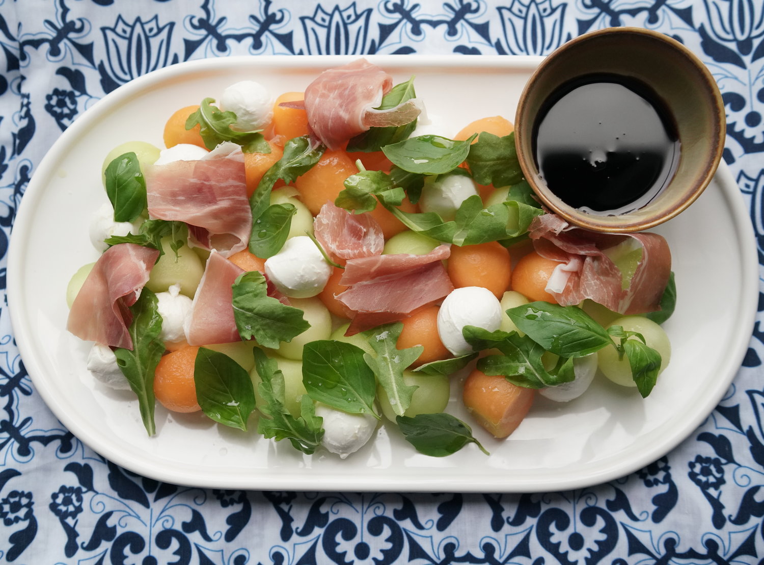 Summer Melon Salad over  Blue &amp; White Tablecloth