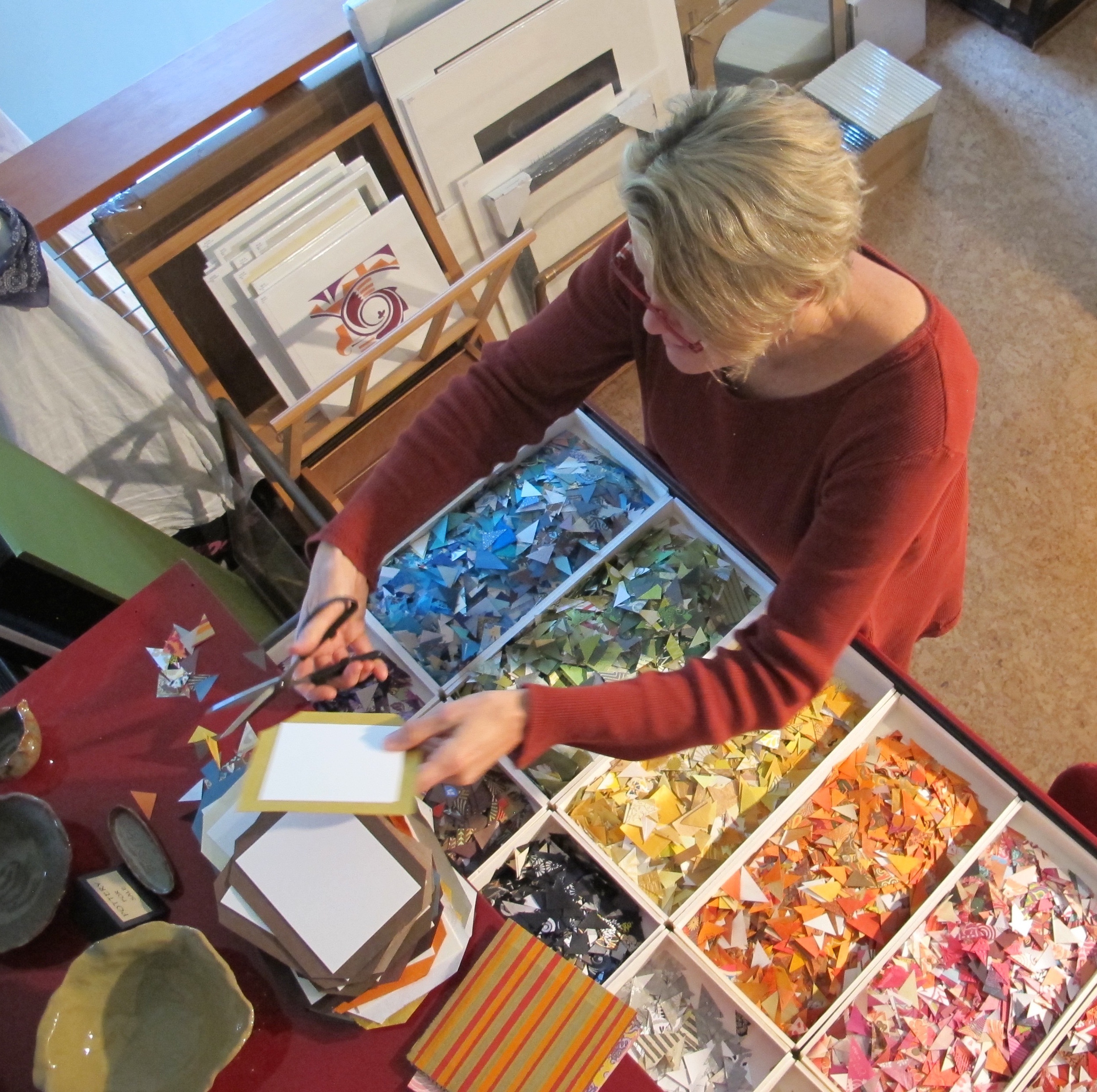 A view over the colorful drawer of paper triangles