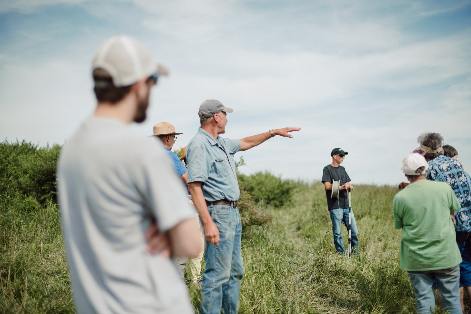 Tour- Dad talking in pasture..jpg