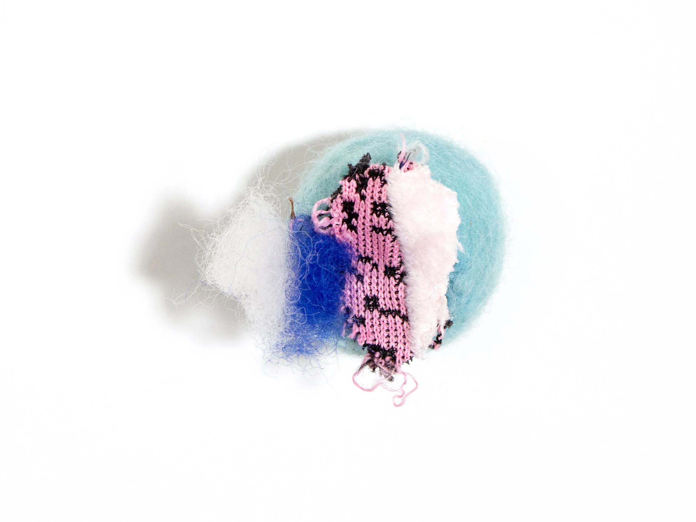 untitled, dog toys and epoxy, 2.25 x 2.5 x 2.25 inches, 2024
