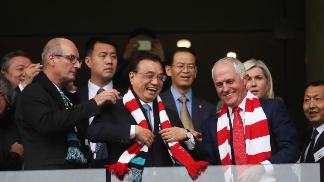 Photo Credit: Li Keqiang with Port Adelaide chairman David Koch, left, and Malcolm Turnbull. Picture. Phil Hillyard
