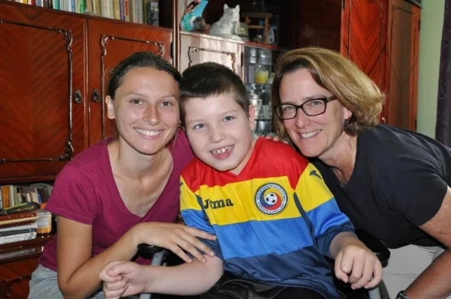 Marti (R) with Natalia (L), the physical therapist at the Darius Houses, with one of RCE's recent Walkathon/Fun Run guests, Florinel.
