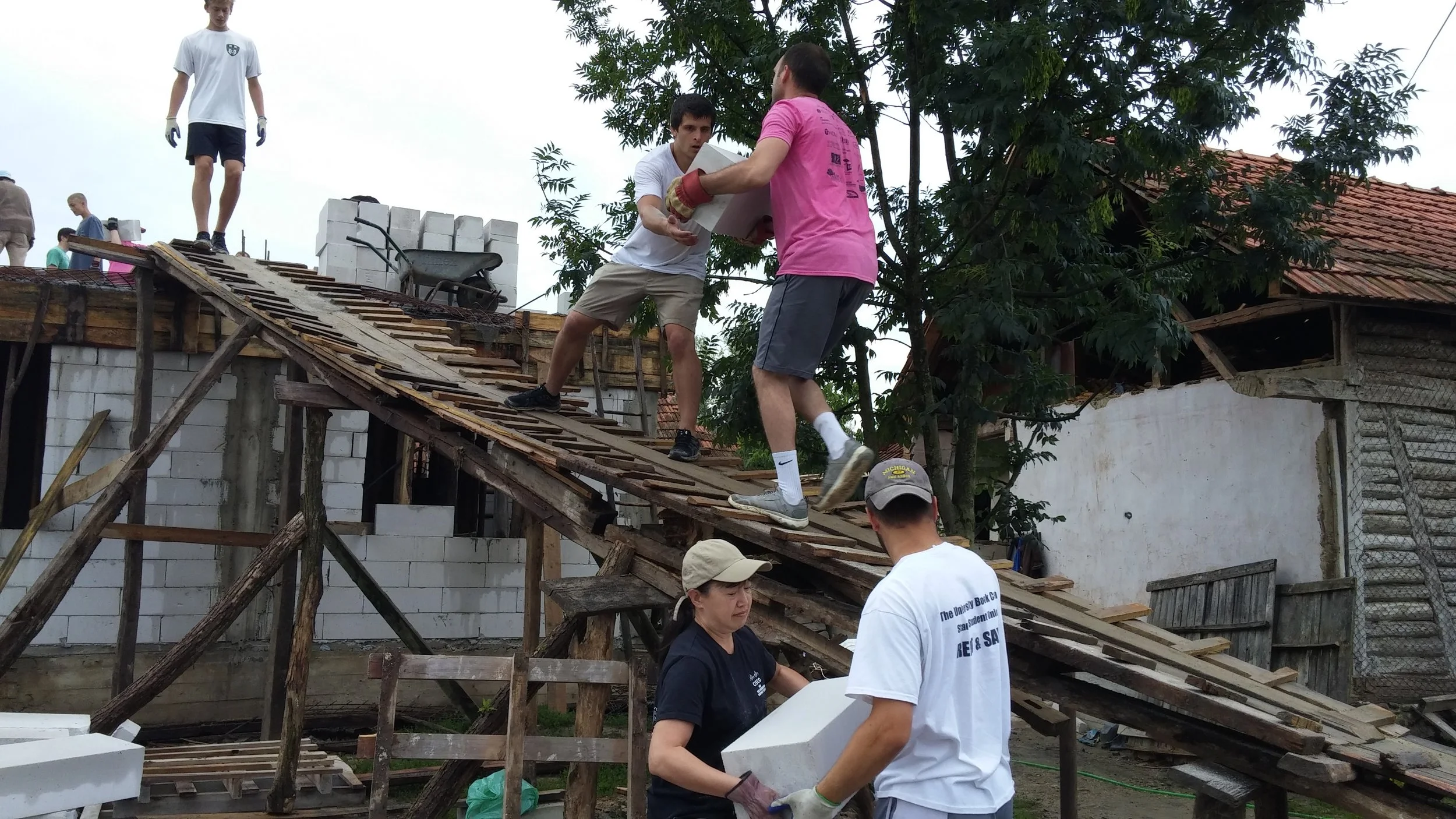 Aaron and a team from Fourth Presbyterian Church work on the Alexi family home.