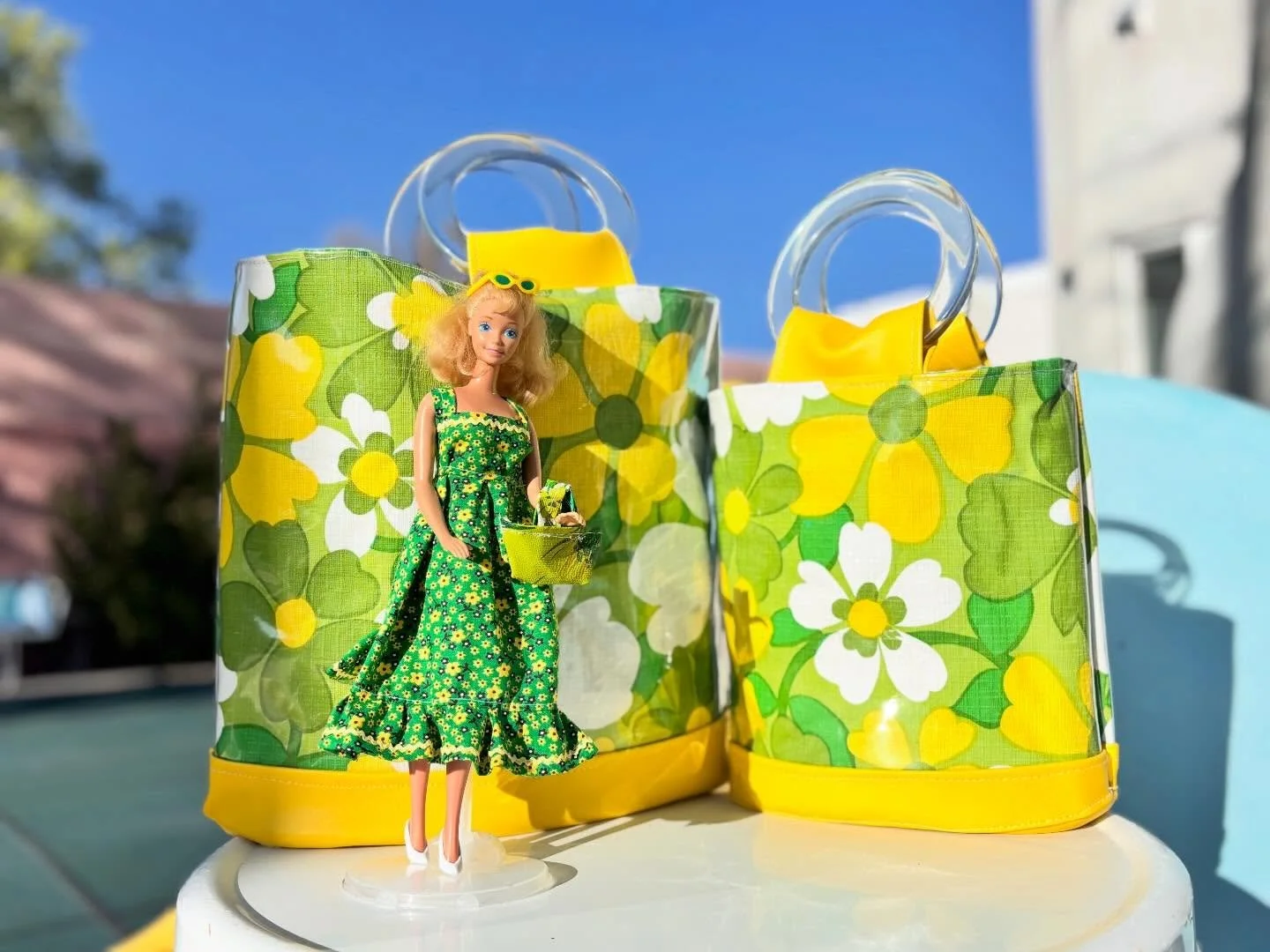 Happy St. Patrick&rsquo;s Day! I created the handbags from a vintage vinyl tablecloth. Barbie&rsquo;s dress is made from a 1990s cotton print and a 1970s Barbie dress pattern. Find the Chelle Bags at www.chellesummer.com. #chellesummerstyle

#chelles