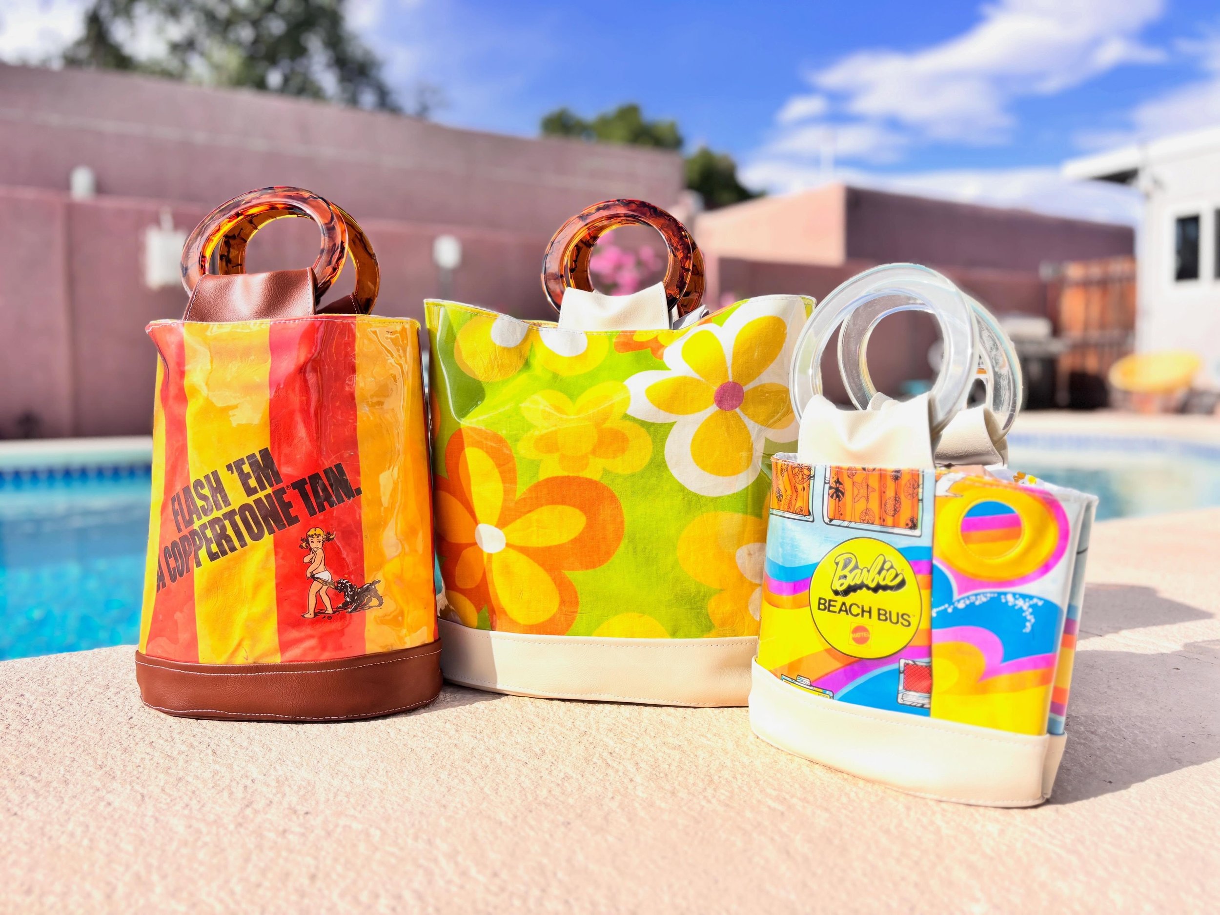 Chelle Summer summer ready. Find the Coppertone (made from a vintage advertising bucket bag) and Barbie 1973 Beach Bus handbags at www.chellesummer.com. The Take Everywhere Grooviest Flowers (made from curtains from @zimboretro at @pspvintage)
has so