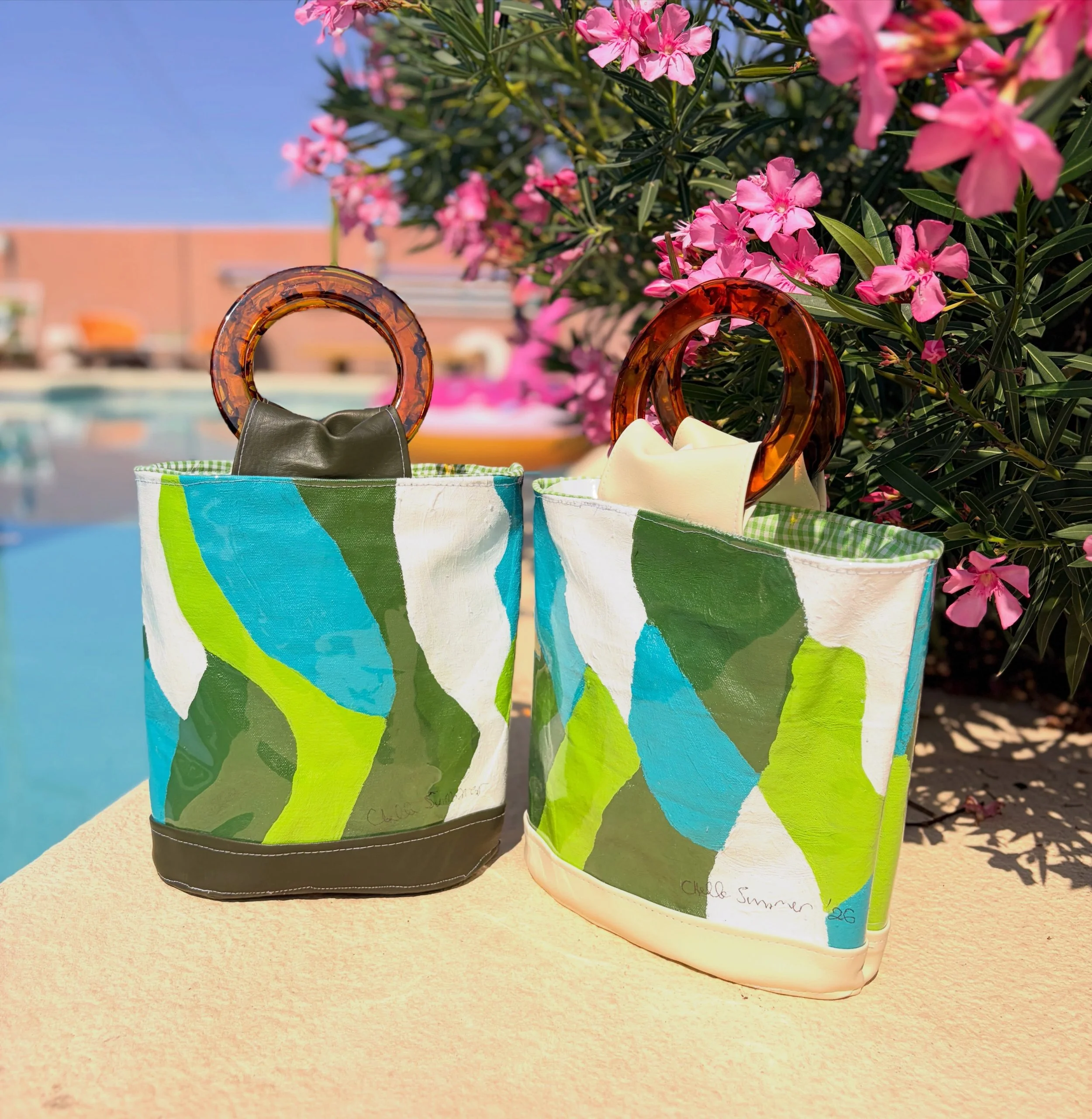 New hand painted- by me!- Chelle Summer handbags (and covered with clear vinyl to protect the canvas). True Chelle Summer style. Find them at www.chellesummer.com.

#chellesummer #handmade #handbag #mystyle