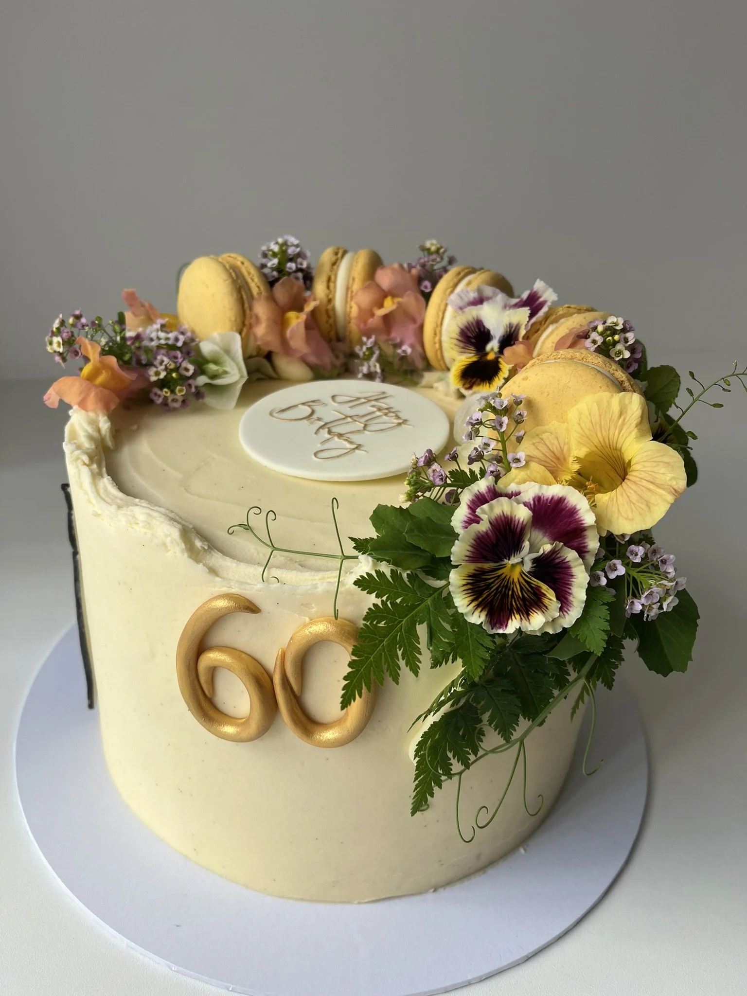 Fully Loaded Crescent with Macarons, Small Flowers and Sprinkles. 