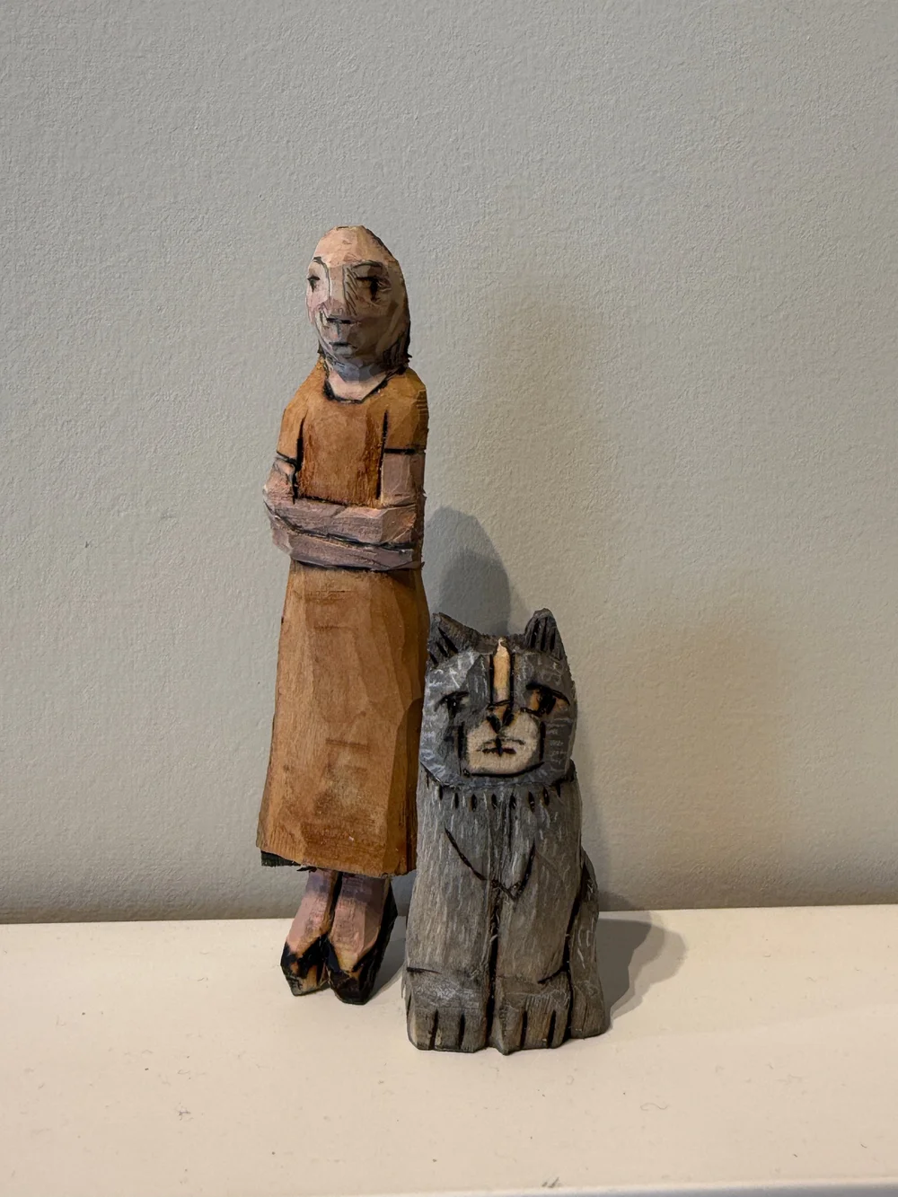 Woman Title in orange dress with cat