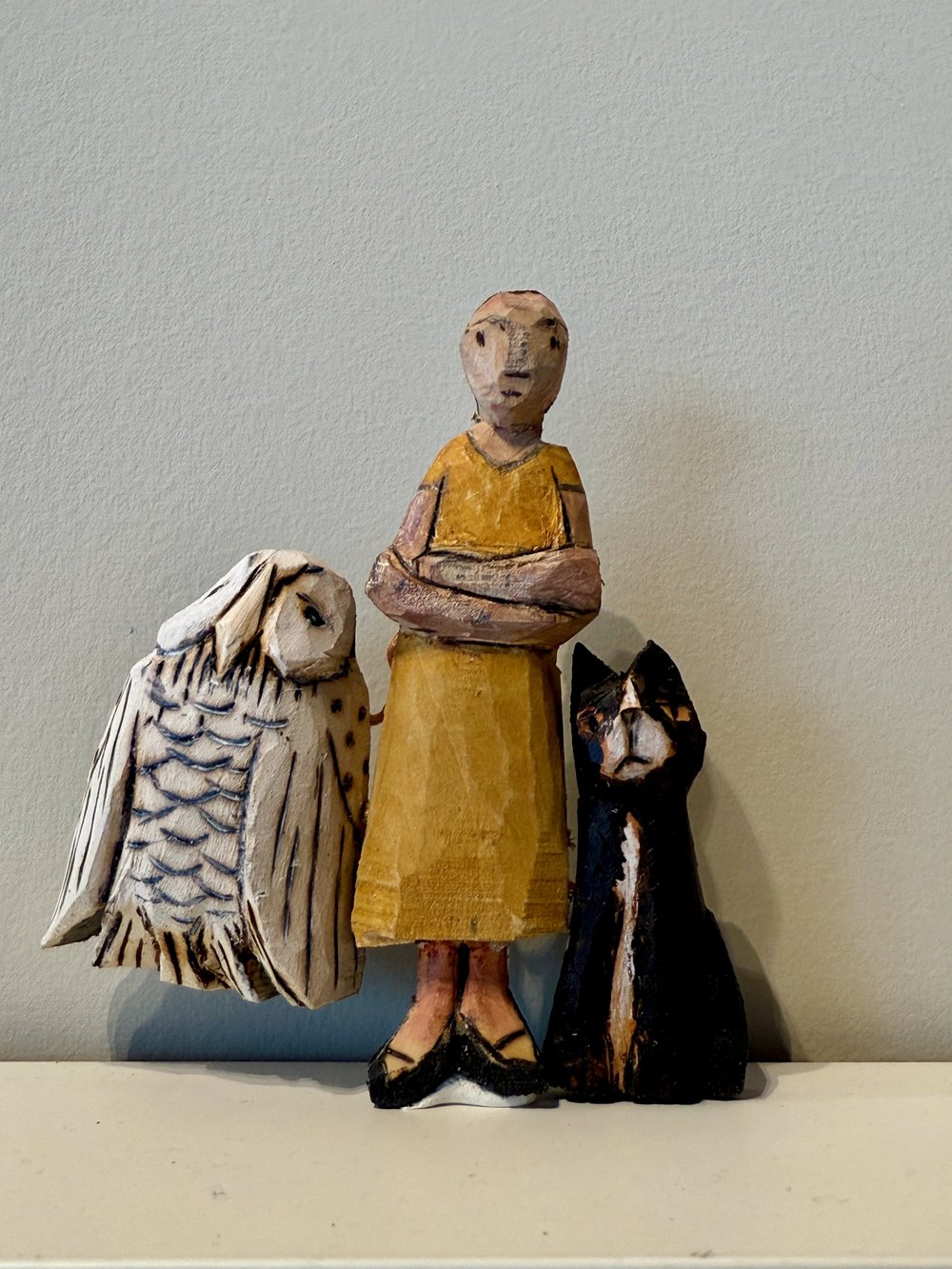 Woman with cat and owl
