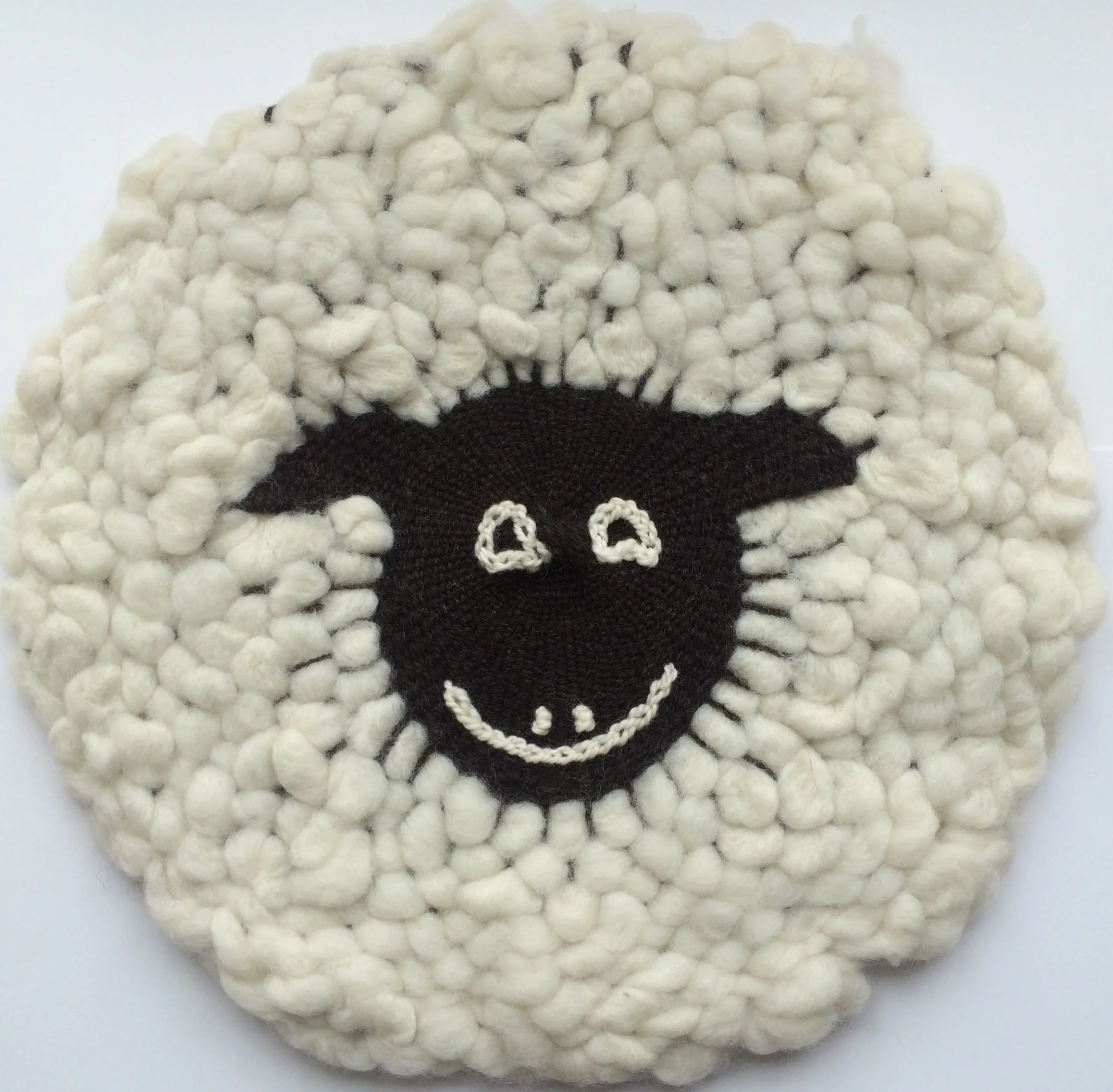 Using the big Majacraft Circular Loom here (450mm) , I wove my sheeps face. I then used wool 'tops' and weave in his fleece. Then lightly needle felted his fleece to hold together. www.TheWheelEwe.co.uk