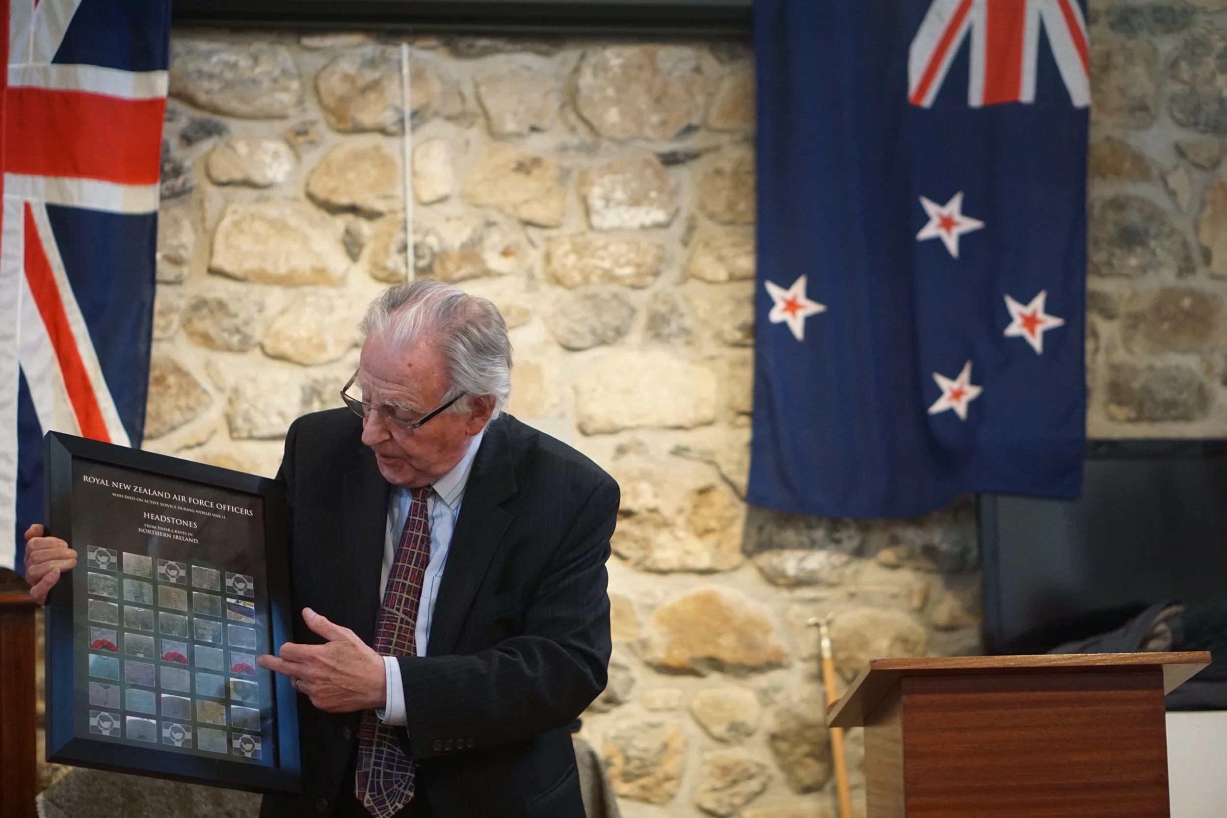Bryan Johnston displaying some of his research into the Royal New Zealand Air Force who lost their lives in Northern Ireland during WWII